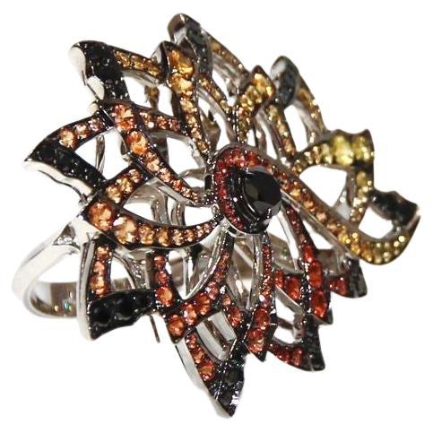 Stephen Webster  Diamonds and Sapphires from Magniphesant  collection Ring
This Ring Is Beautifully Crafted from 18K White Gold, Black Diamonds and Multi Colored Sapphires.
Retail $14,000.00
