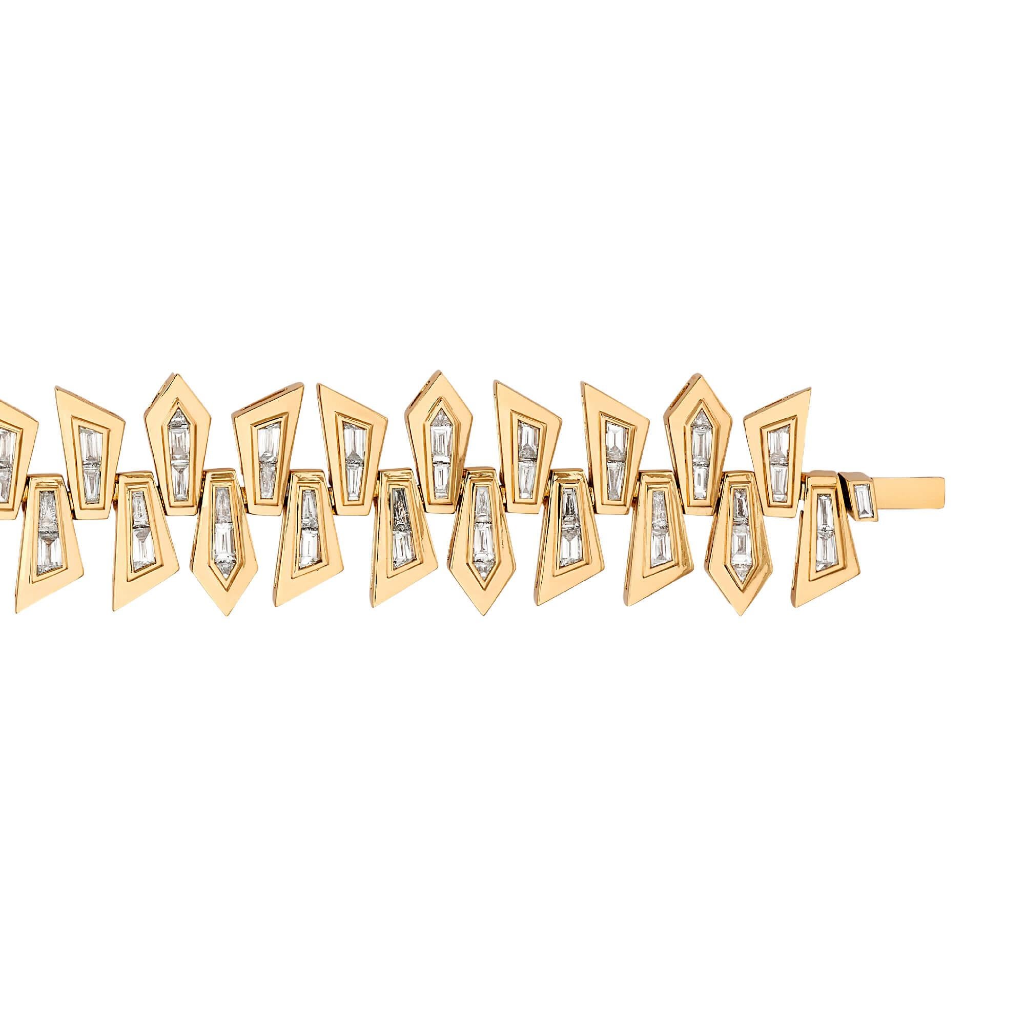 Taking inspiration from fragments of post-modern architecture, Stephen Webster presents the Dynamite Shattered Bracelet. Set in 18 karat yellow gold, with tapered baguette cut and trilliant cut white diamonds (6.10 carats).

Please enquire for your