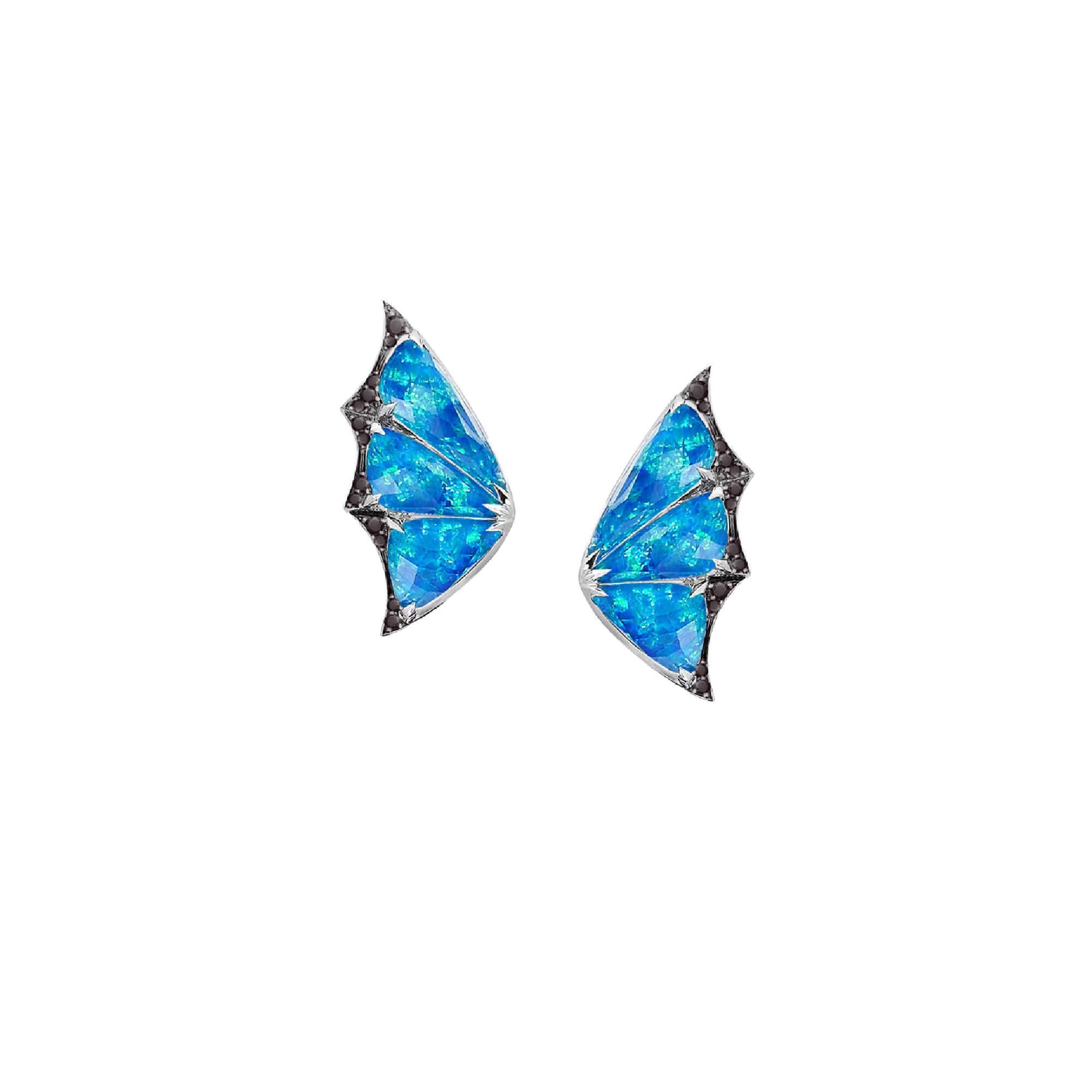 The winged creatures that dwell in dark forests inspire this pair of 'Fly By Night' Crystal Haze Long Earrings. This pair of earrings are meticulously handcrafted in 18ct white gold, black opalescent with clear quartz Crystal Haze (8.43ct), 1.59ct