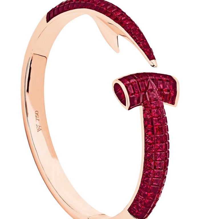 Dive for precious bounty with the Hammerhead 18 karat rose gold bangle. The Hammerhead bangle combines Webster's love of the aquatic with a sleek silhouette and intricate gem setting.

Handcrafted in 18 karat rose gold and set with square-cut rubies