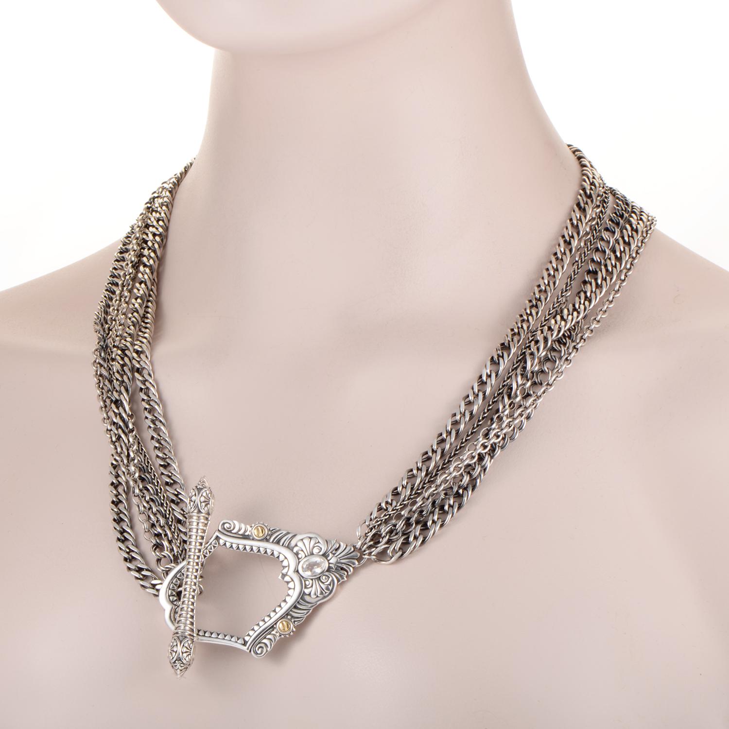This extraordinary statement piece boasts a stunning pendant that is designed in a compellingly offbeat fashion, attached onto multiple, diversely stylized chains for an intriguing effect. The necklace is presented by Stephen Webster within the
