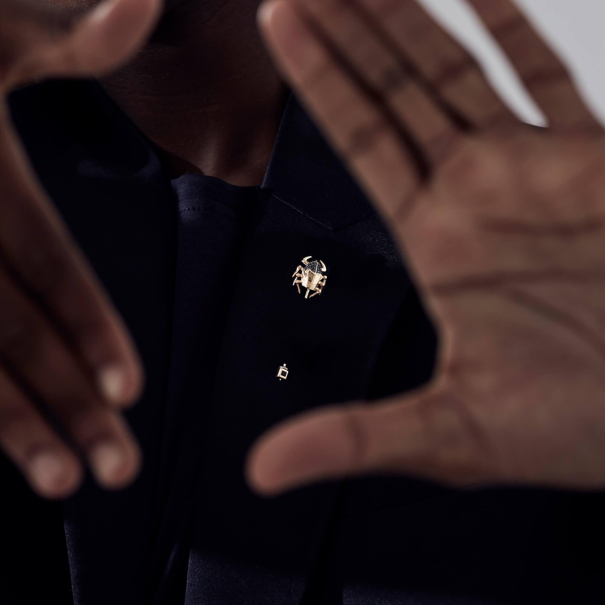Inspired by our Jitterbug collection, the Jitterbug Toro Beetle Lapel Pin is a playful take on achieving a stylish finish for a polished look. This elegant pin features black Diamond pavé (0.15ct) and black Spinel (0.10ct) set in 18ct yellow