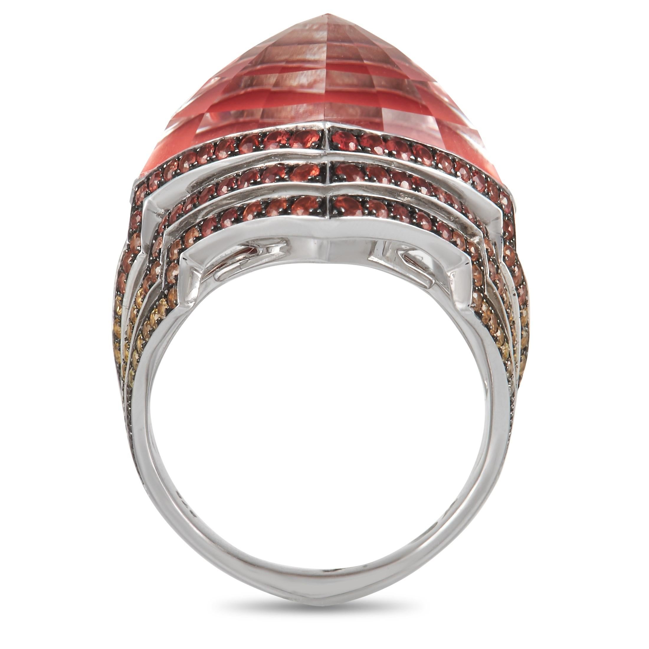 Infuse a bit of pizzazz to your classic wardrobe with this Stephen Webster ring. It features a 5mm band with a ring top height of 10mm. The ring has a faceted pink opal stone center sitting on top of quartz, giving that captivating Crystal Haze