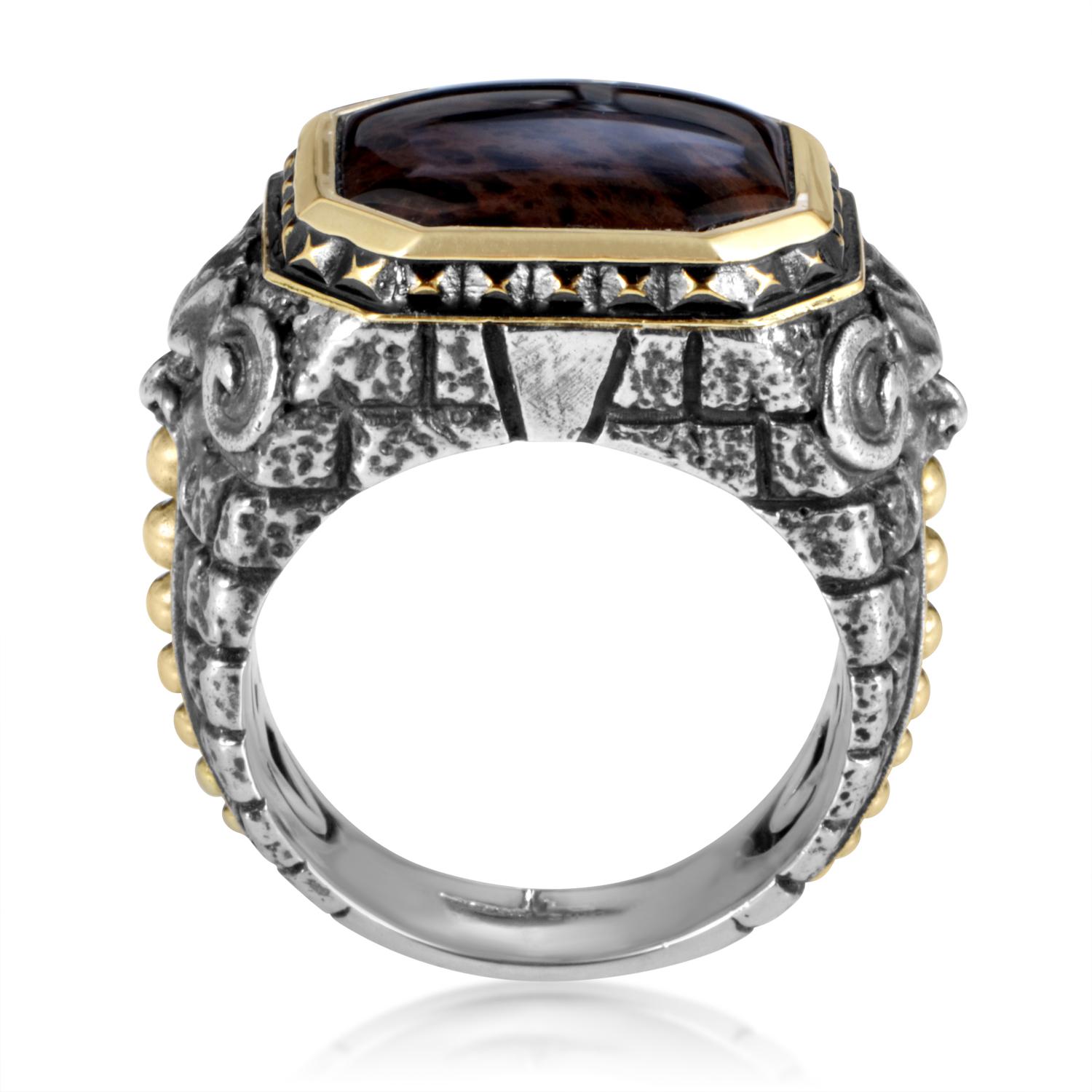 Inspiration taken from majestic architecture has resulted in a daring ring by Stephen Webster. Brickwork and gargoyle engraving provide a stern yet fascinating basis for this sterling silver ring that is topped with 18K yellow gold bezel setting