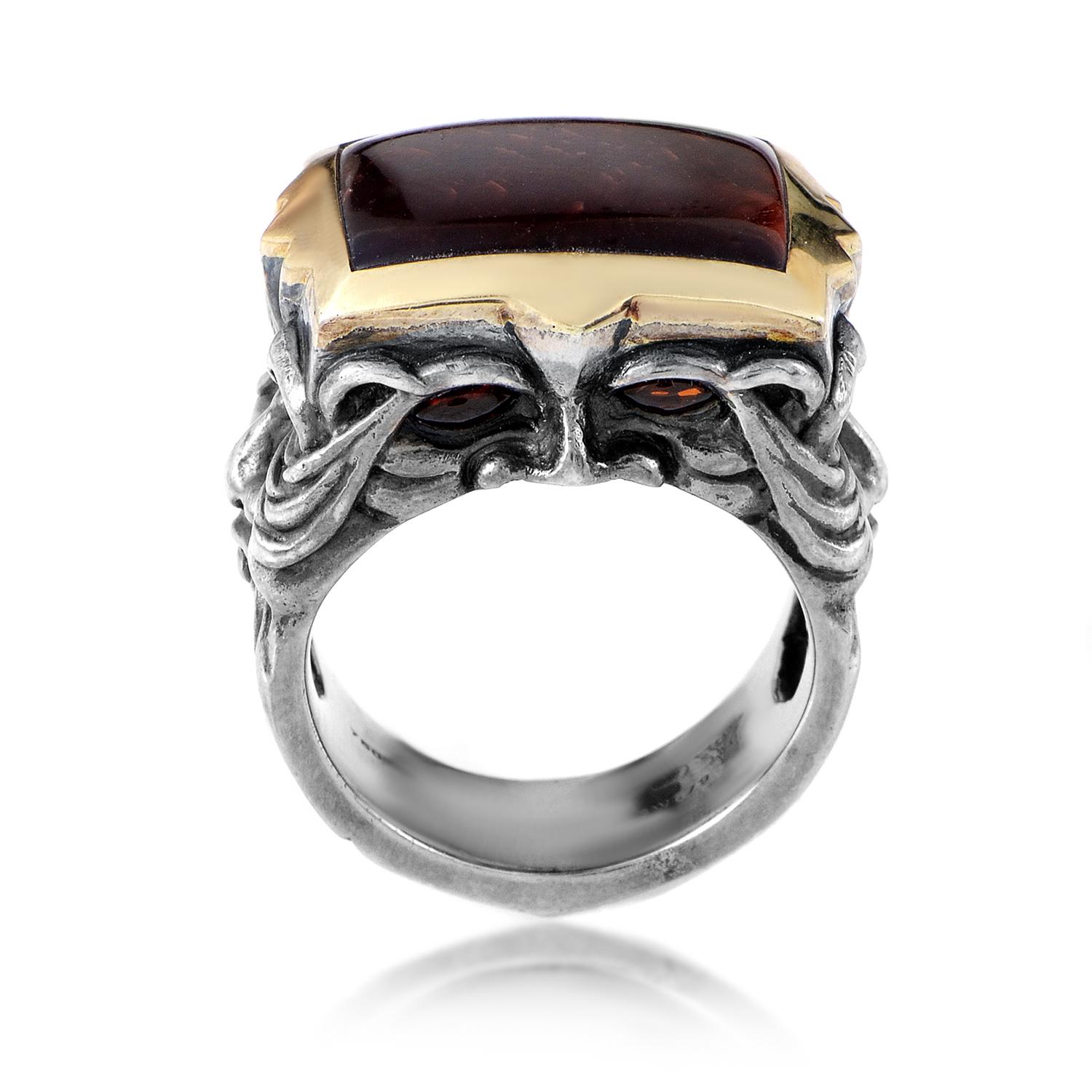 The appealing bull's eye stone lends its classy luxurious look to this remarkable piece from Stephen Webster made of oxidized silver, artistically depicting gargoyle heads. 
Band Width: 10mm
Ring Top Height: 10mm
Ring Top Dimensions: 22mm x