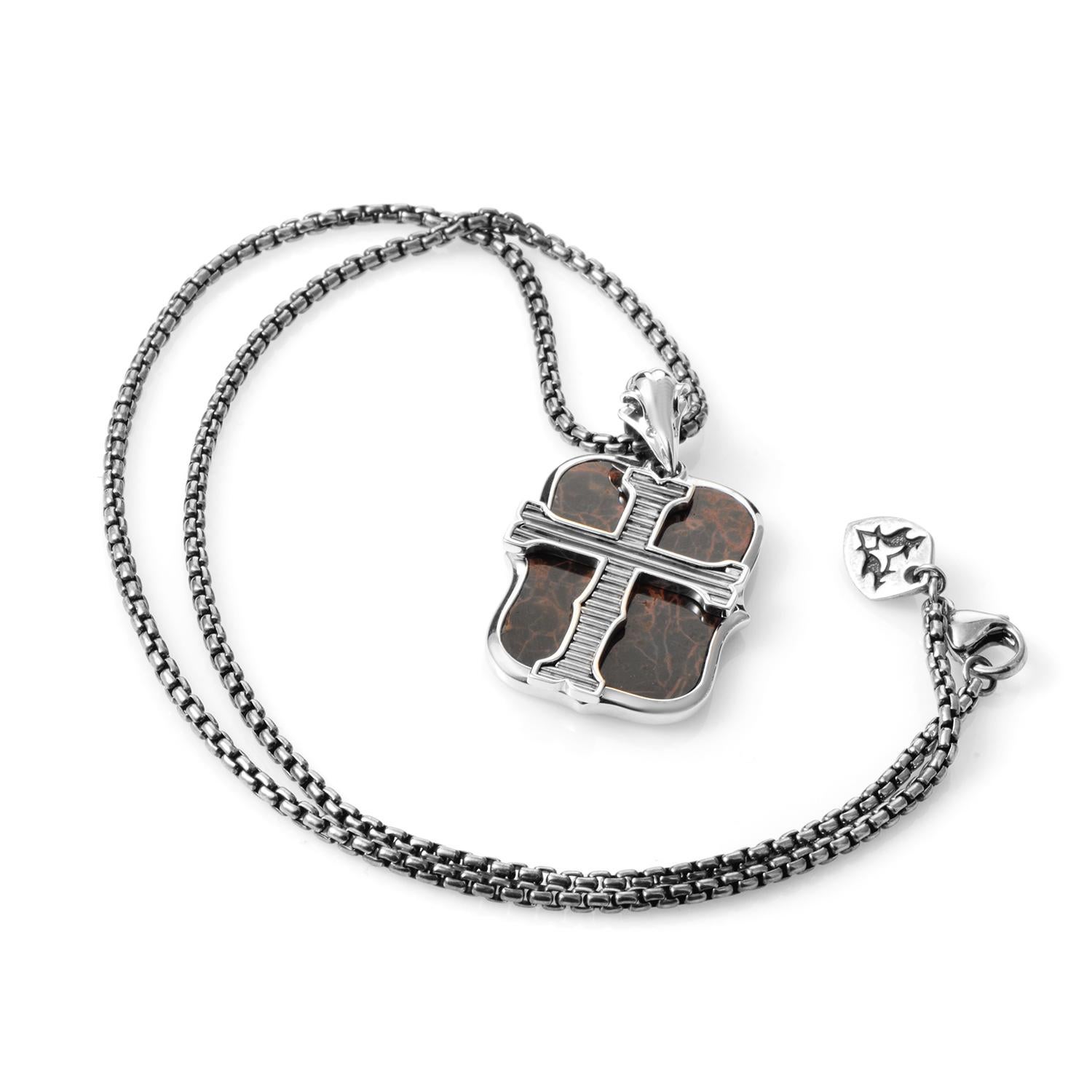 The daring lines of this Stephen Webster dog tag is true to their cutting edge designs and artistry. This sterling silver box chain and dog tag is a fiery example of modern design thoughtfully making use of old-world influences for a touch of