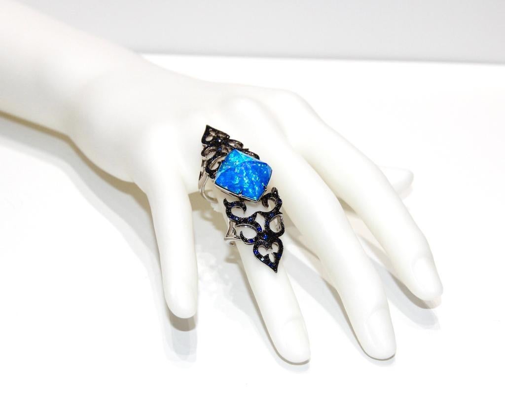 Stephen Webster Long Finger Blue Sapphire and Opal ring
18K White Gold 
Blue Sapphires 0.44ctw
Black Diamonds 0.80ctw
Opal 13.5ct
Retail $8,950.00
