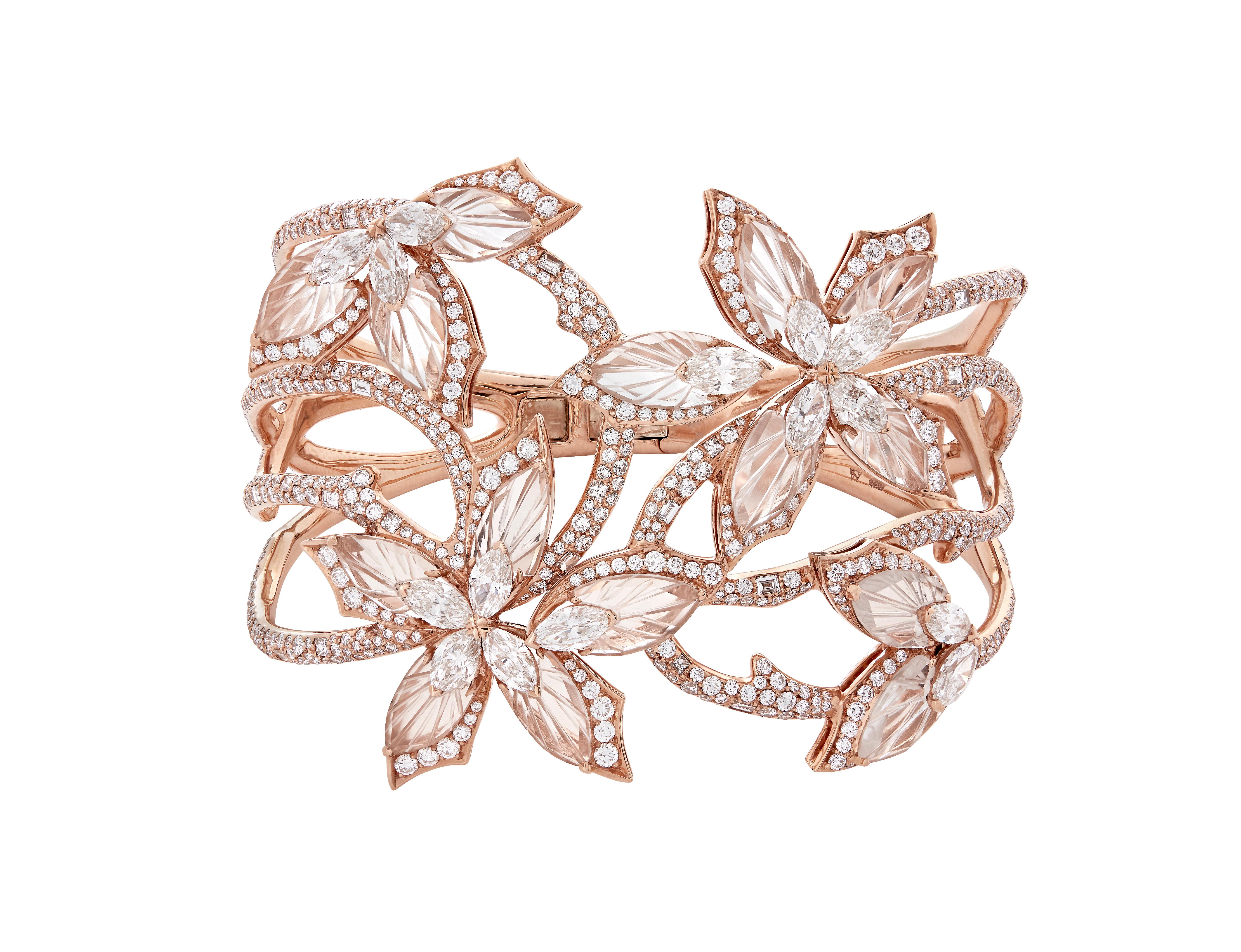 Love Me, Love Me Not Couture Bangle in 18ct rose Gold set with marquise-cut white Diamonds (5.45ct), white Diamond pavé (8.02ct), baguette-cut white Diamonds (1.06ct), and a facetted Rock Crystal surround (11ct).

Inner Dimensions - 57mm x