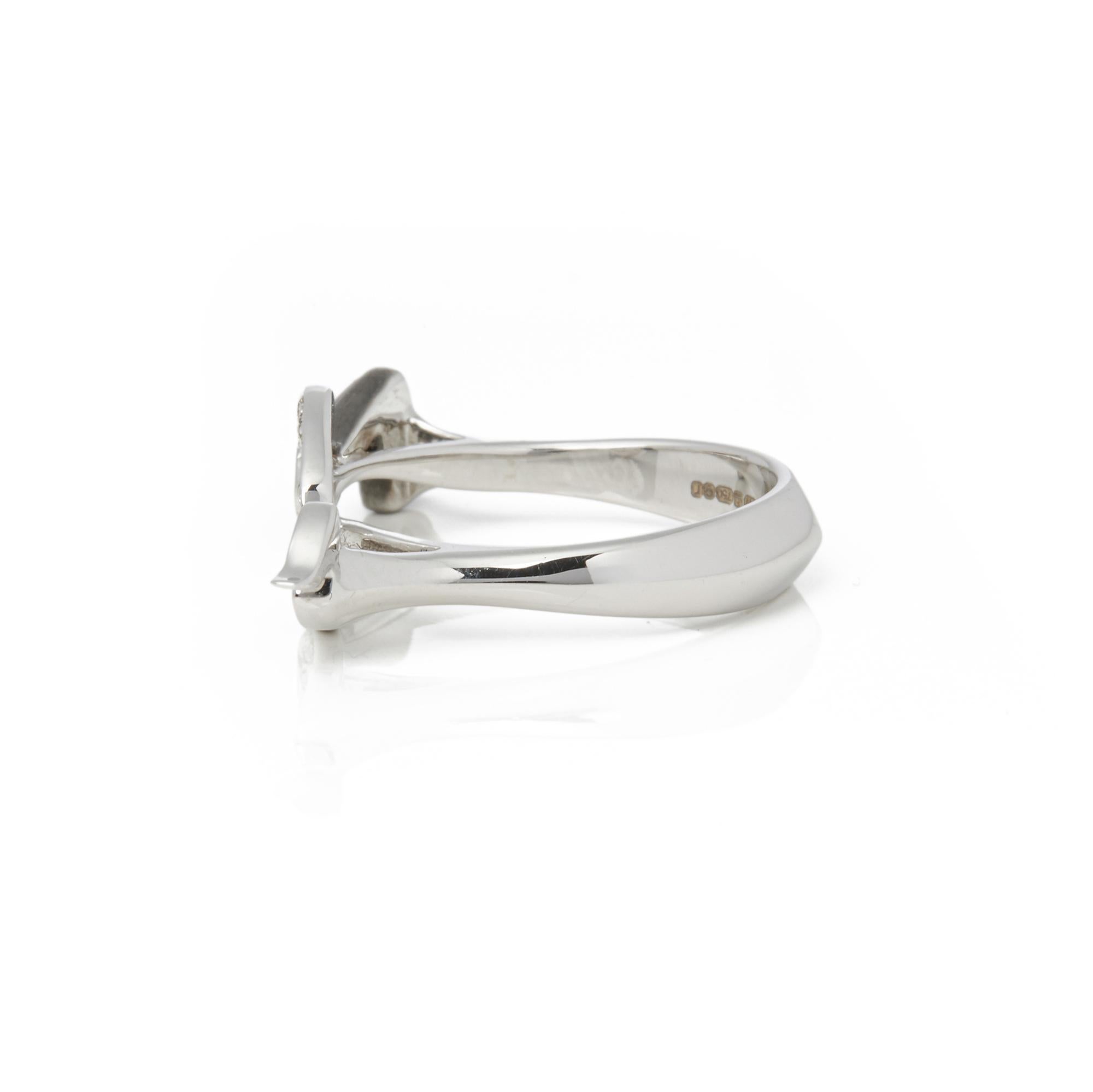 This ring by Stephen Webster is from his Murder she Wrote collection and features pave set white diamond taking the form of a smoking gun Set in white gold with signature band. Ring Size N. Complete with Xupes presentation box. Our Xupes reference