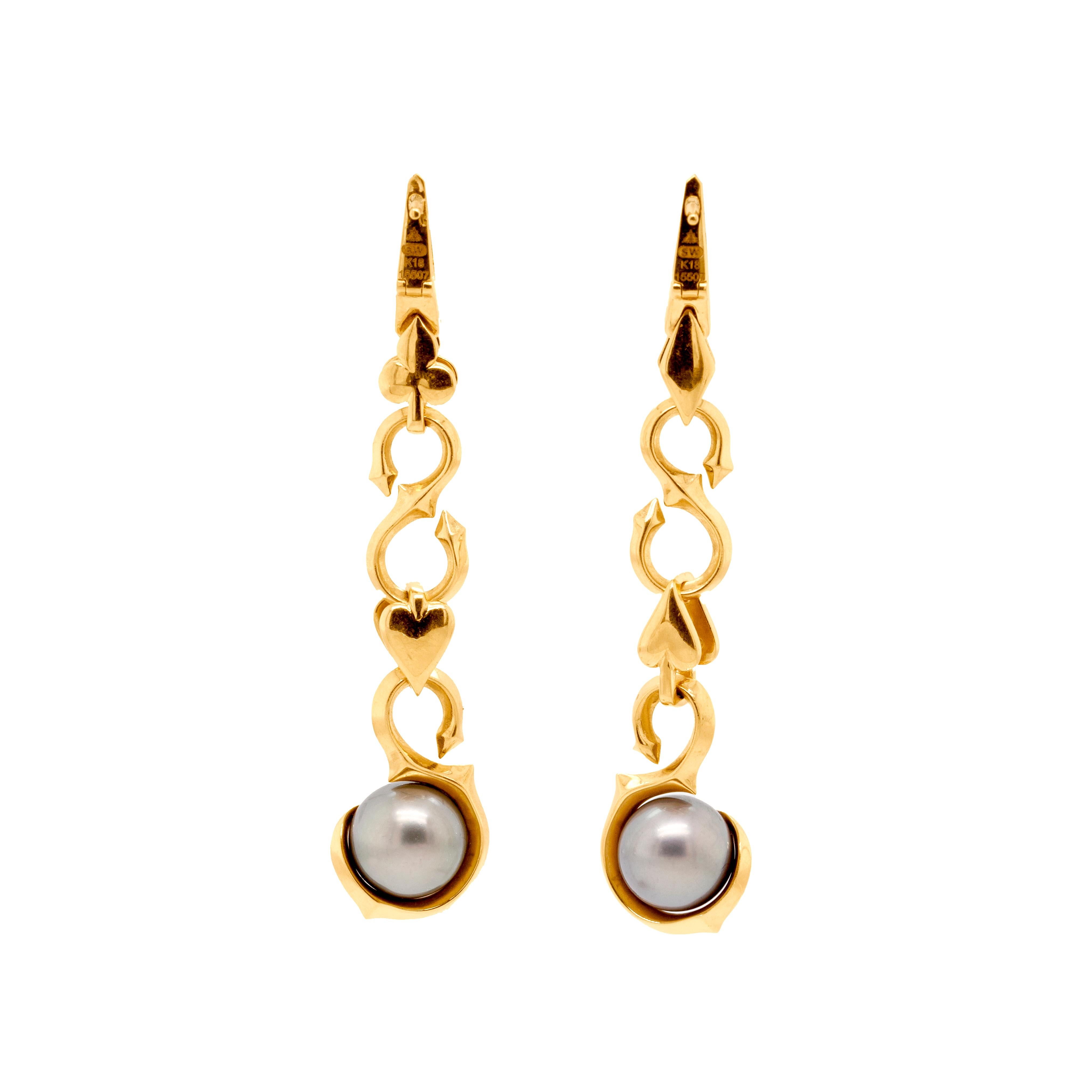 These gorgeous ruby, diamond and Tahitian pearl Stephen Webster drops are the ultimate statement earrings. Crafted out of 18ct yellow gold, these diamond and ruby-set playing card themed earrings are truly unique. 

Seven gorgeous diamonds are grain