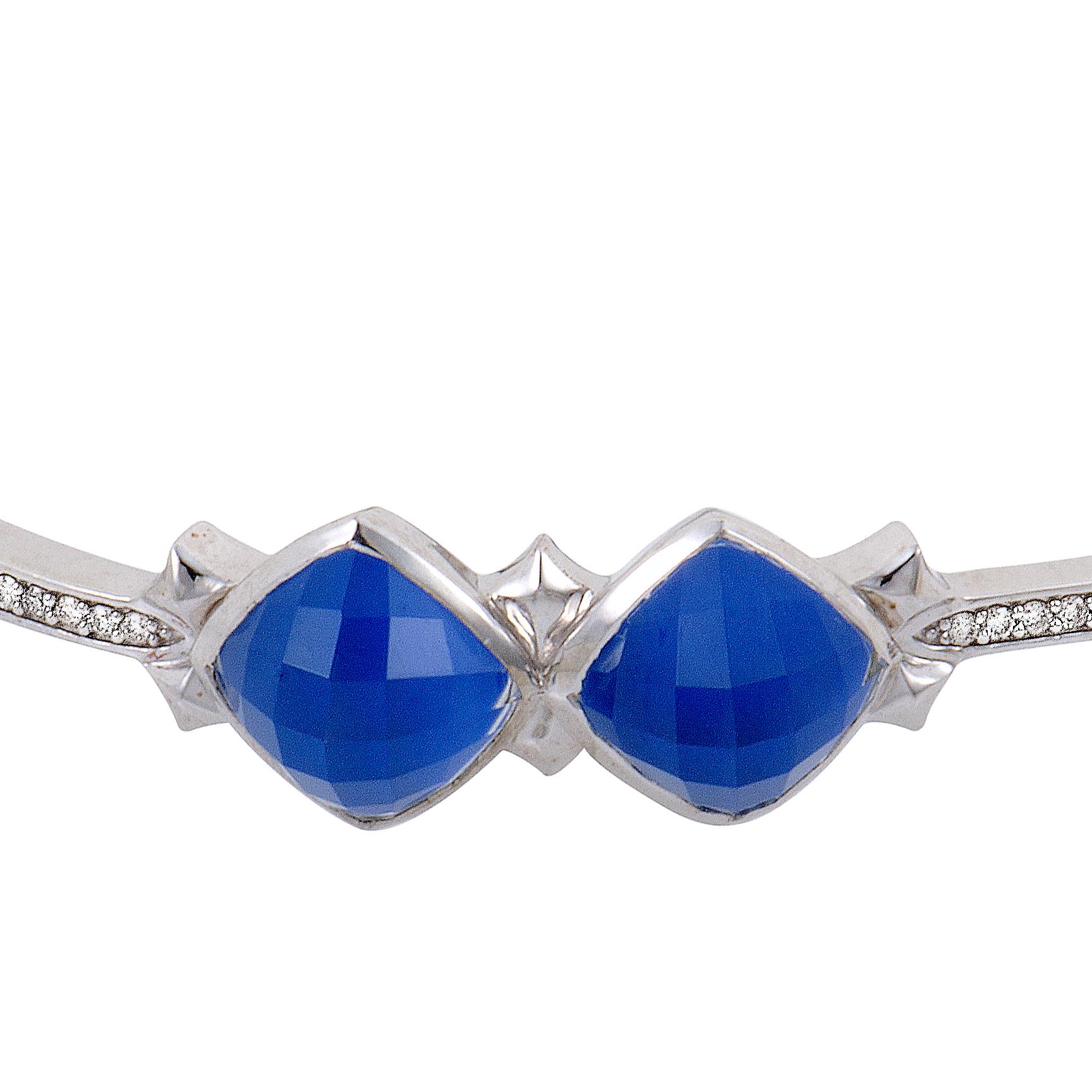 Exquisitely cut gems, fantastic color and an elegantly tasteful overall appearance produce an irresistible allure in this sublime bangle from Stephen Websters Superstud collection made of white rhodium-plated silver with blue agate, quartz and