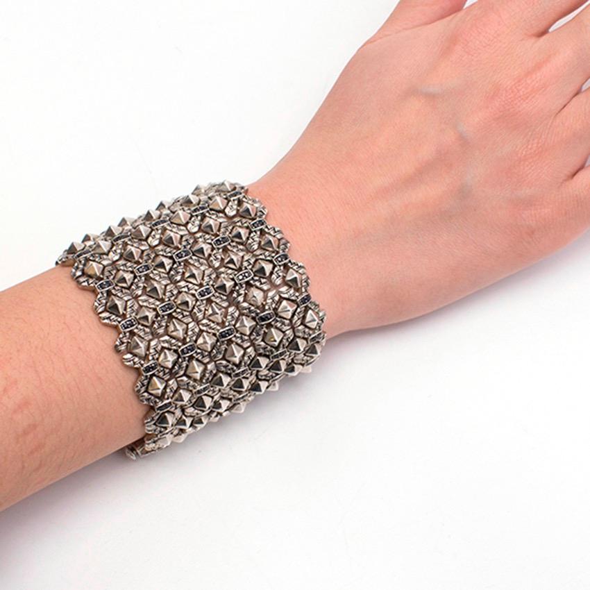 Stephen Webster heavy sterling silver plated cuff bracelet from the Superstar collection, featuring studs and black sapphire stones. Five rows of engraved links. 3.29 total carat weight.

Fabrics: Sterling Silver.

Please note, these items are