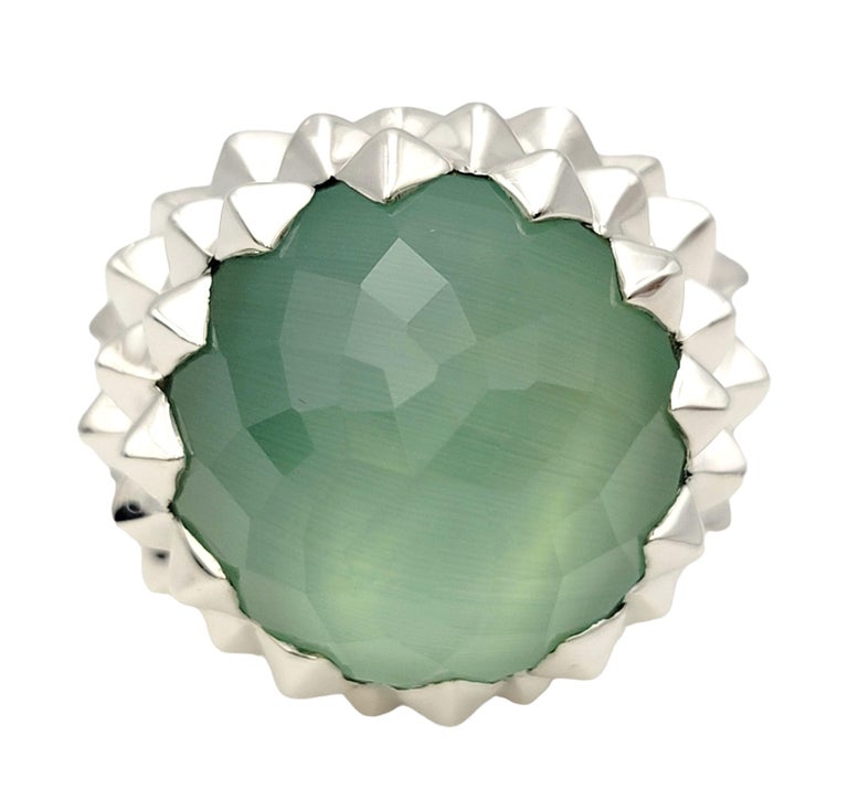 Ring size 8.5

Bold, high profile cocktail ring by Stephen Webster. The faceted green quartz doublet stone pops against the sterling silver setting, while the textured studs surrounding the stone give it some modern edge. 

Ring size: 8.5
Weight:
