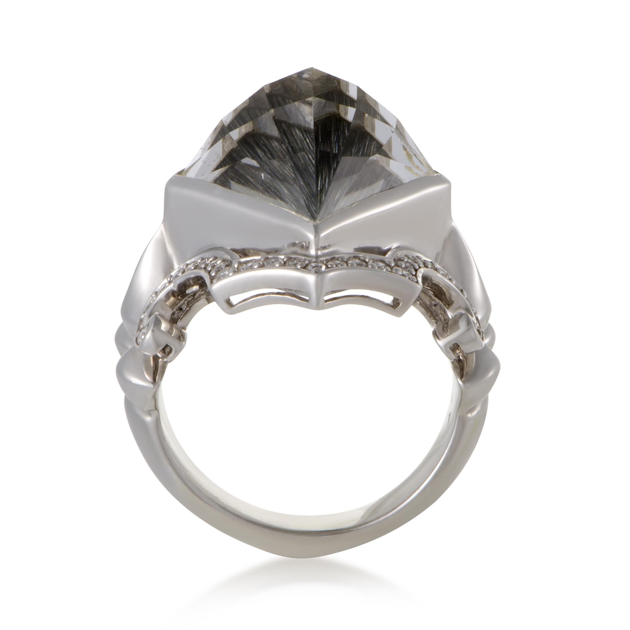 The exquisitely offbeat design of this ring combined with an incredibly captivating gemstone décor create an exceptional aesthetic effect in this ring. The ring is expertly crafted from white rhodium-plated silver, and set with eye-catching cat’s