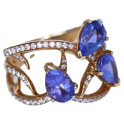 Stephen Webster Tanzanite and  Diamonds Ring Signed 18K Yellow Gold. The design of the ring is really impressive with natural motives and fine Diamonds incorporated beautifully into the thin gold branches. Holding three pear-shaped Tanzinites of
