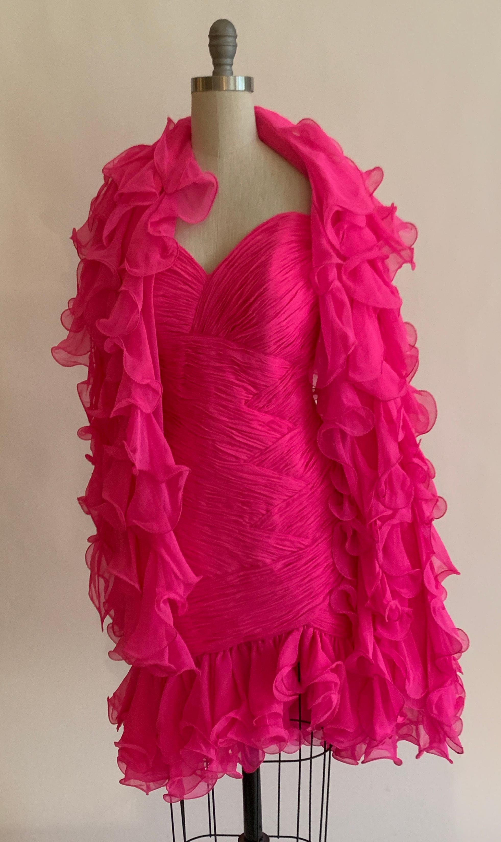 Amazing vintage Stephen Yearick 1990s hot pink dress and coordinating scarf with voluminous ruffles and pleating detail throughout bodice. Dress fastens with back zip and hook. 

100% silk.
Fully lined in 100% polyester.

No size listed, best fits a