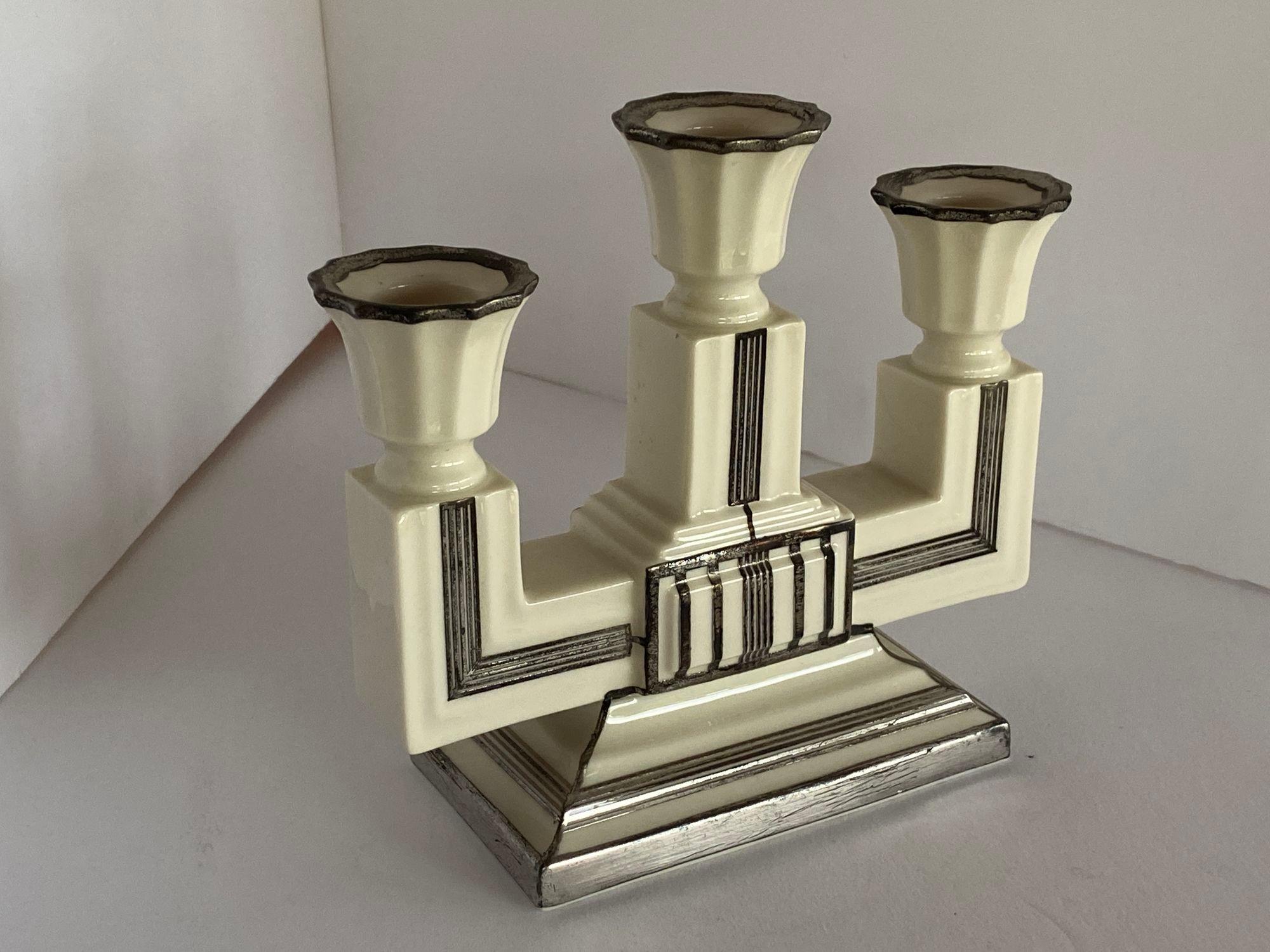 Stepped Art Deco ceramic candelabra with sterling silver overlay by Lenox.

Circa 1930.