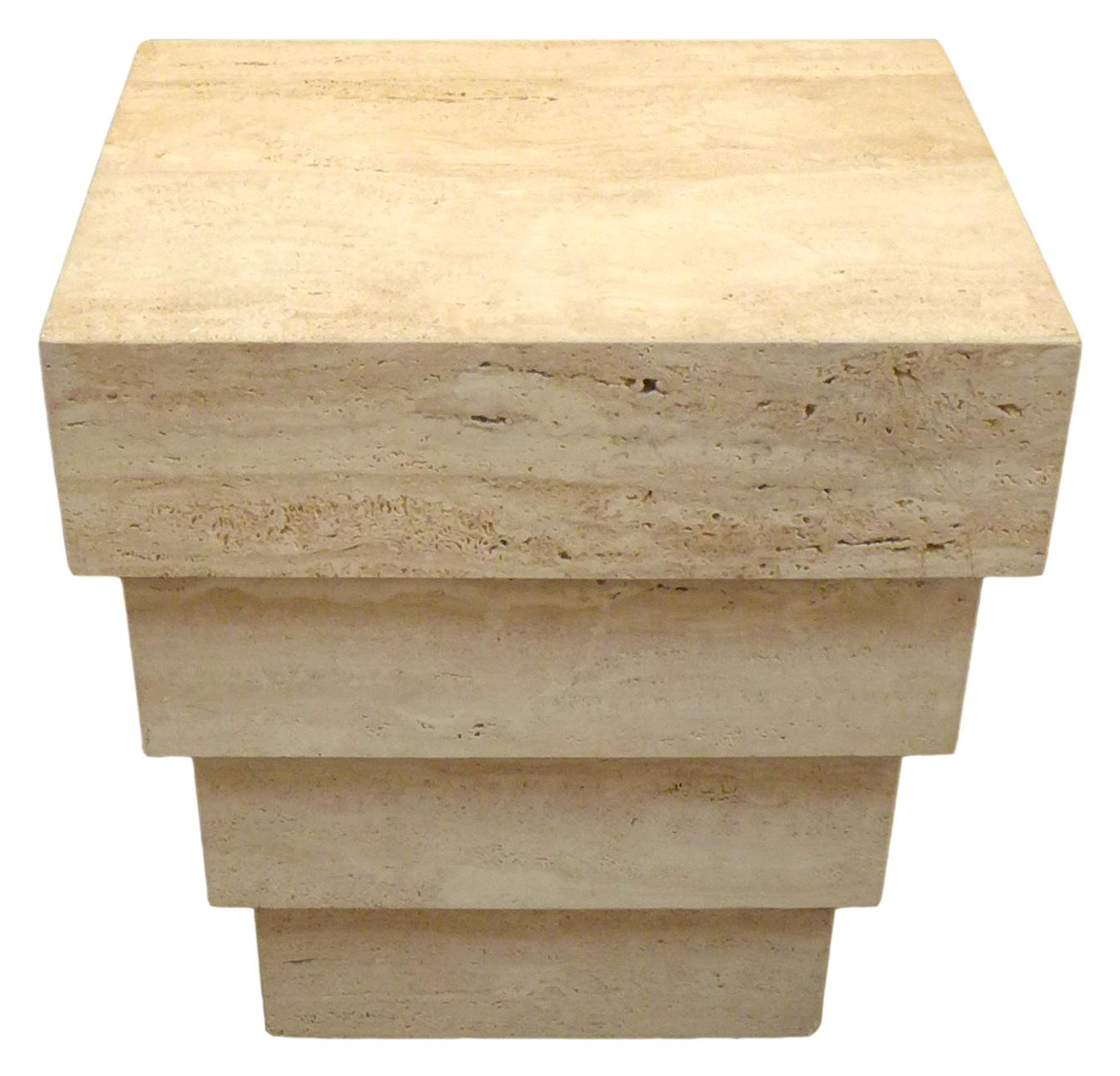 A powerful table design in travertine of stacked, stepped and graduated rectangular forms. This strong and Minimalist piece functions well as either a side table, small console, pedestal or table base. A striking and unusual decorative element.