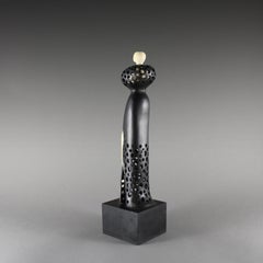 Stepping Out, Ebony and Holly wood sculpture by Nairi Safaryan