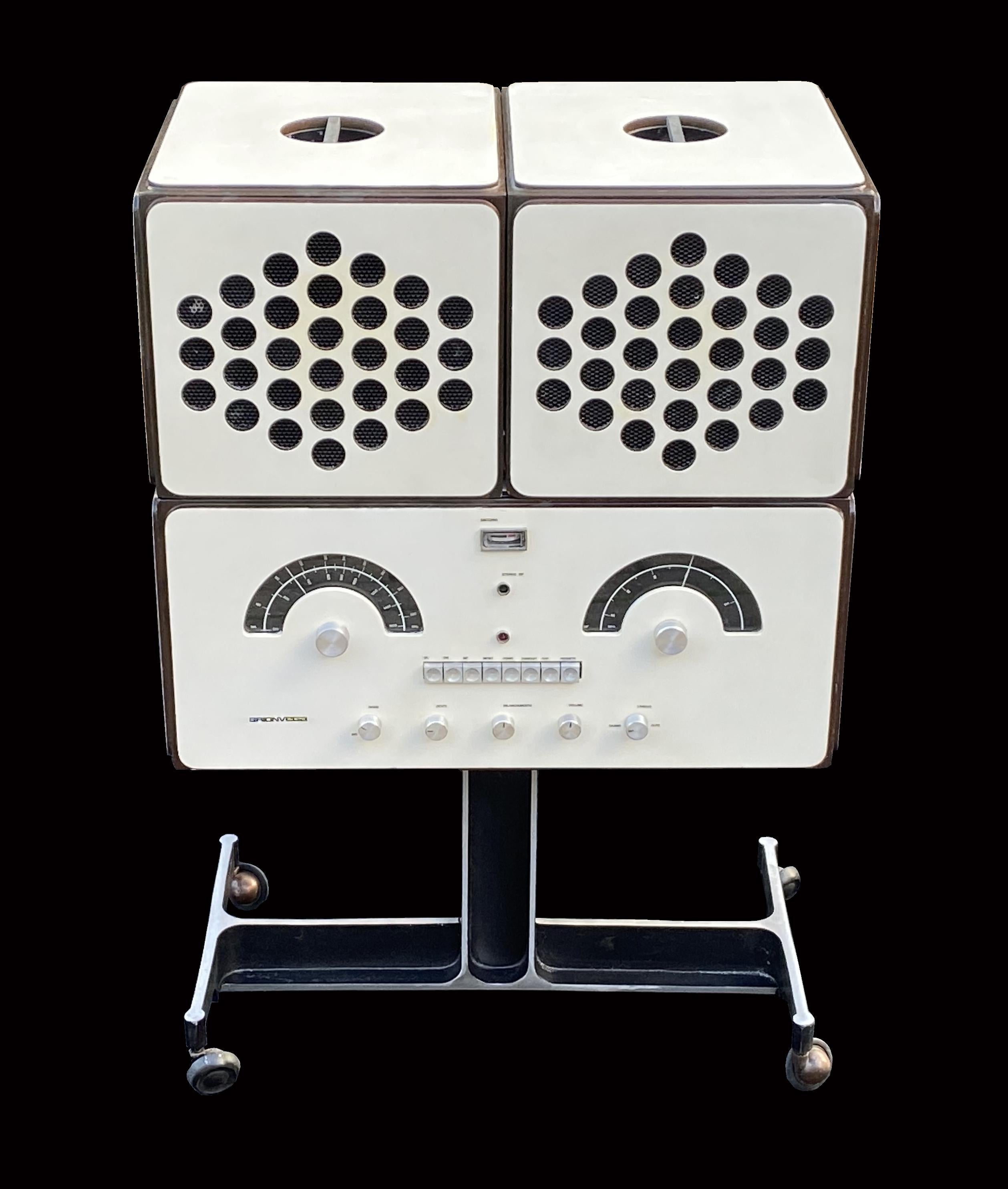 This Classic piece of Italian Design by Achille and Piergacomo Castiglioni for Brionvega.
An amazing item, stereo radio, and record player, with original Dual turntable, and having just been serviced is currently working fine, but one really owns