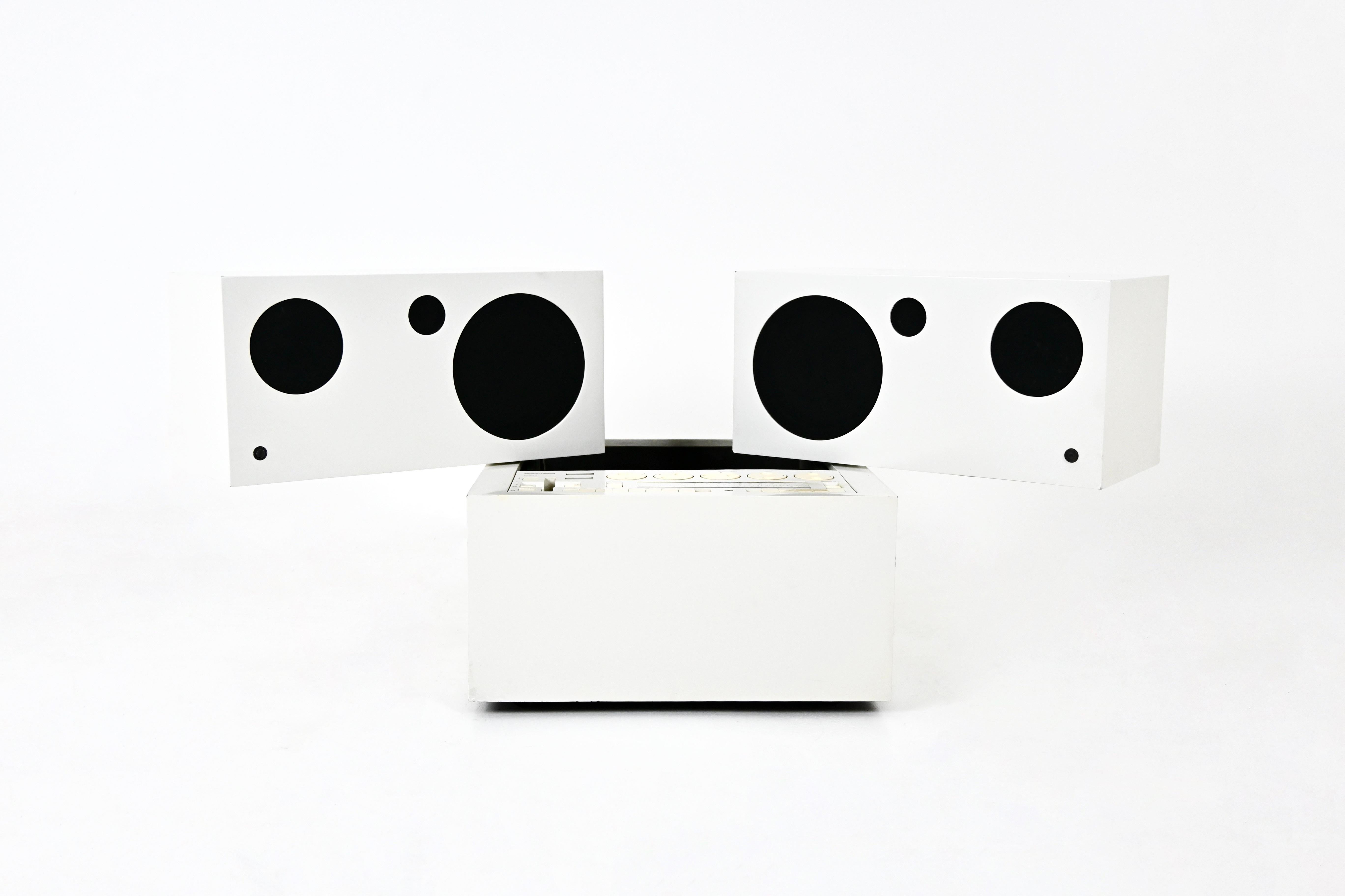 White Brionvega stereo radio, Totem model. The radio and record player work perfectly and have been completely overhauled by an engineer. There's a bluethoot connection for connecting a mobile phone. Dimensions in closed position: height 53 cm,