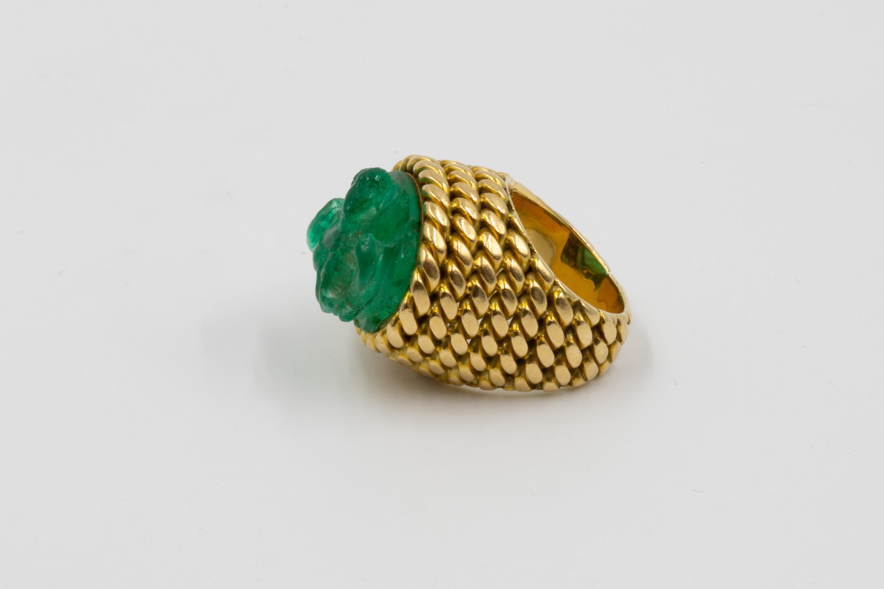 Exceptional Carved Emerald Ring by Sterlé at Second Petale Gallery. 

A woman is depicted in bust form, holding a snake in both arms. 
The emerald cameo is most likely ancient, perhaps 17th century, and probably depicts a goddess. 
Signature: Sterlé