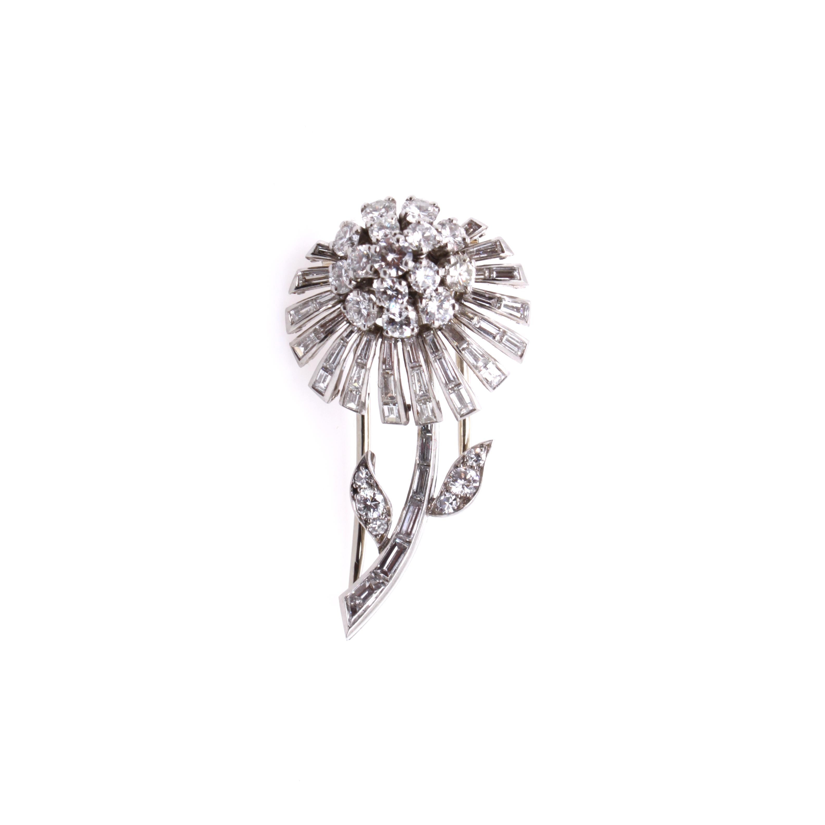 Sterlé Diamond Flower Brooch, ca. 1950s

A beautiful minimalistic diamond dandelion brooch pin from the 1950s made by Pierre Sterlé.
The pin beautifully combines baguette cut diamonds with round brilliant cut diamonds, creating a dandelion flower,