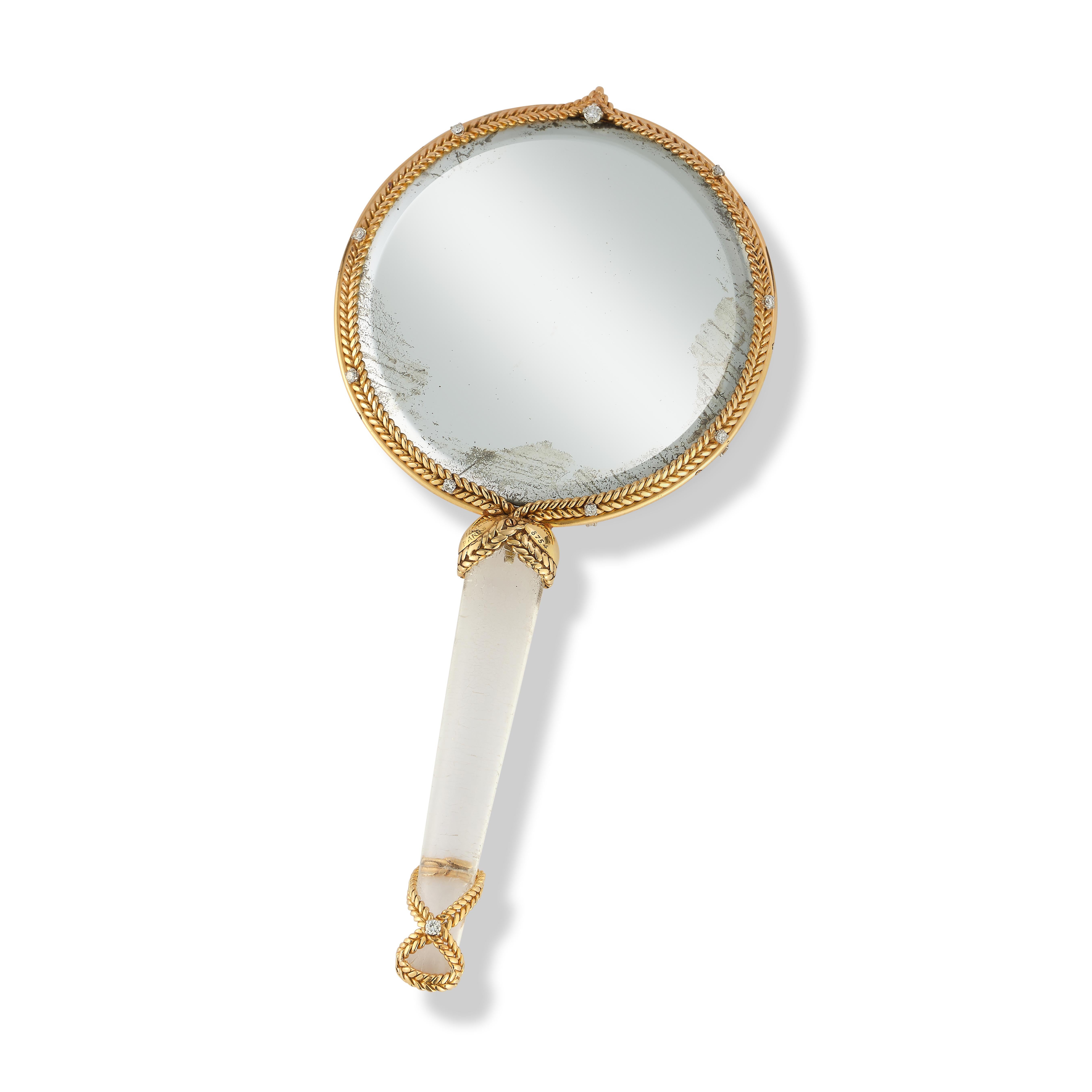 Sterle Gold Hand Mirror

A double sided mirror with an acrylic handle set in 14 karat gold accented by 19 round diamonds

Signed Sterle Paris and numbered

Circa 1960

Measurements: 6.5