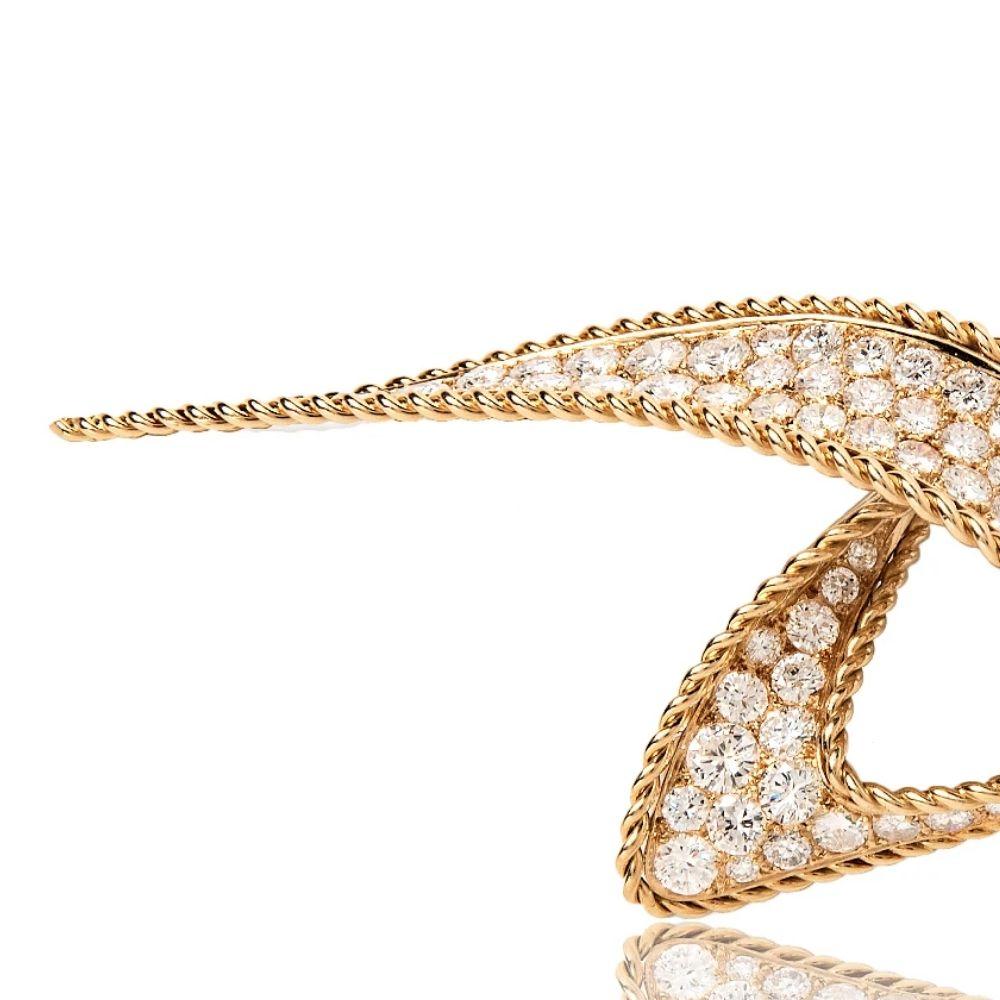 Known as the “couturier of jewelry,” Pierre Sterlé was inspired by the asymmetry of the natural world. He often paired the warm tones of yellow gold with vibrant gemstones, as in this mid-century brilliant cut diamond brooch. The rope twist surround
