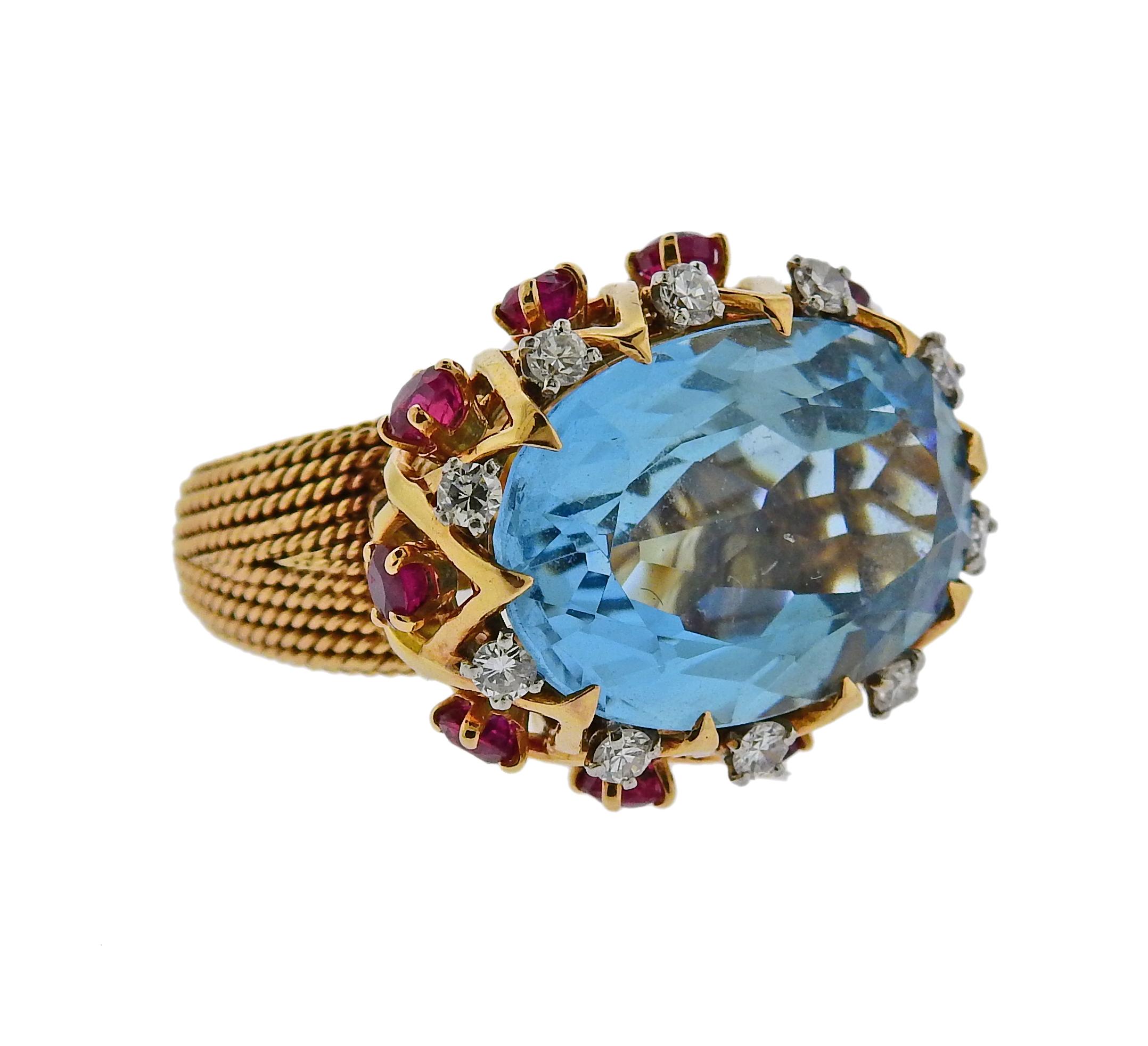 Exquisite vintage Sterle Paris ring, set in 18k yellow gold, featuring an approx. 20 carat aquamarine, surrounded with rubies and approx. 0.40ctw in G/VS diamonds. Ring size - 4.25, top of the ring measures - 21mm x 26mm, sits approx. 15mm from the