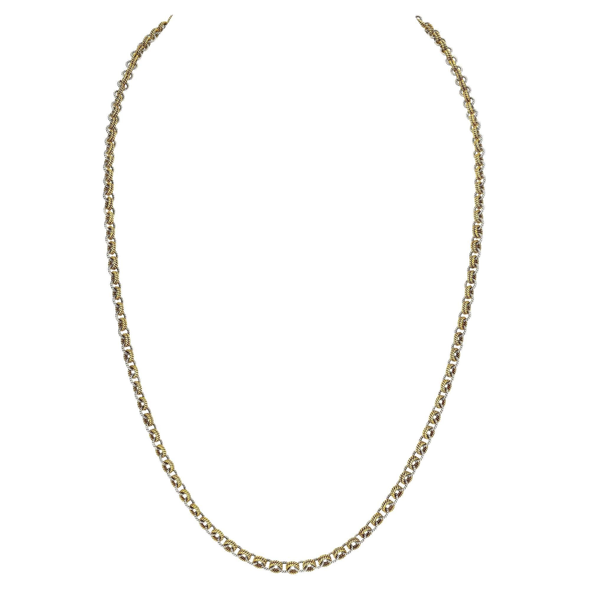 Unchained melody.  This collectible Sterle Paris bi-colored 18 karat white and yellow gold round twisted link vintage chain will keep you singing.  Circa 1975.  30
