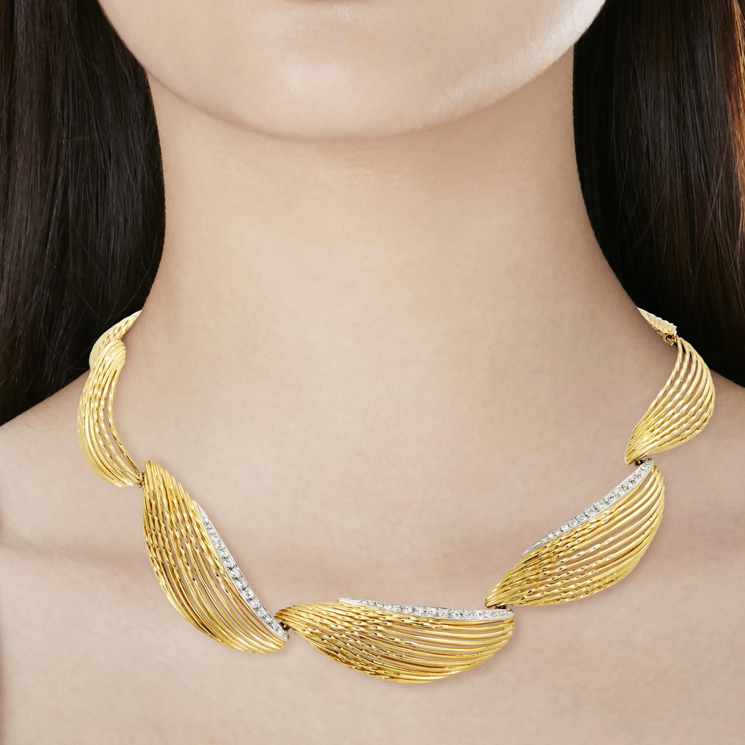 An impressive Pierre Sterle Paris necklace showcasing graduating links adorned with round brilliant cut diamonds in shimmering 18k yellow gold. The necklace measures 14.5