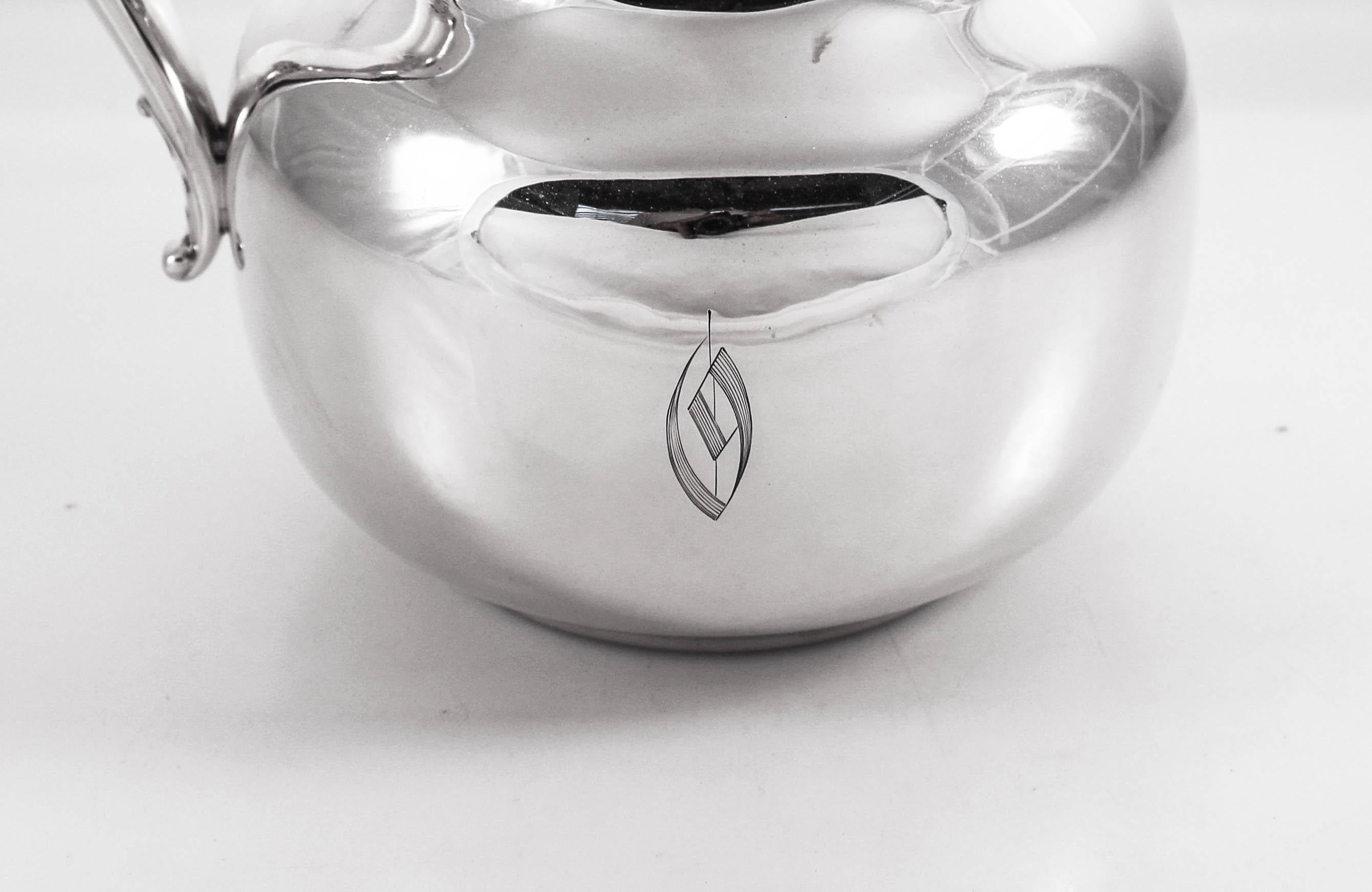 This sterling silver water pitcher is signed 1908; that’s one hundred and twelve years ago. We had it restored to its original beauty— dents and scratches removed and polished to perfection. Now it’s ready to dress up your dining room table! It has