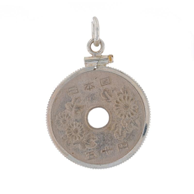 Metal Content: Sterling Silver (pendant) & Silver Toned (coin)

Measurements
Tall (from stationary bail): 1 3/32