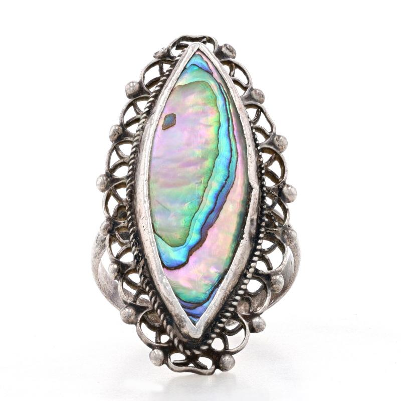 Size: 6 1/4

Metal Content: 925 Sterling Silver

Stone Information

Natural Abalone

Style: Cocktail Solitaire
Features: Filigree lace detailing with split shoulders & rope-textured border

Measurements

Face Height (north to south): 1 3/8