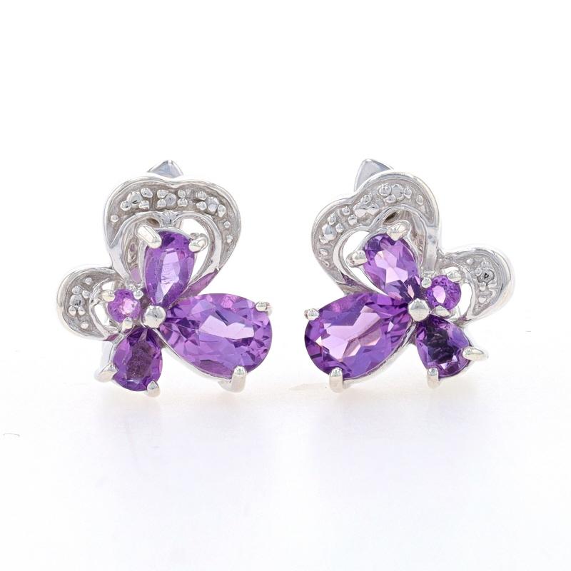 Metal Content: Sterling Silver

Stone Information

Natural Amethysts
Carat(s): 1.95ctw
Cut: Pear & Round
Color: Purple

Total Carats: 1.95ctw

Style: J- Hoop
Fastening Type: Snap Closures
Theme: Flowers, Clovers

Measurements

Tall: 17/32
