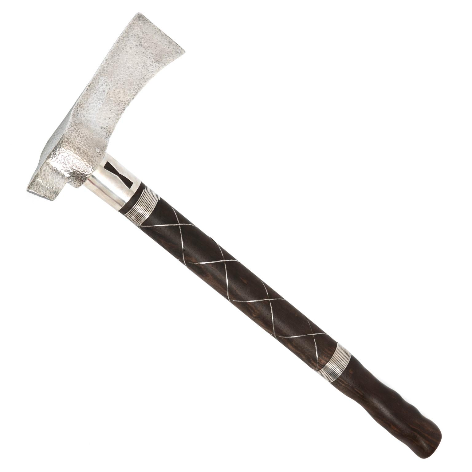 Circa 1920s, Sterling, 22k, American.   A one-of-a-kind objet, this sterling axe was made in the 1920s. Set with a 1925 gold piece, it suggests a tomahawk and is also very similar to Norse axes of the 10th century. We do not who made it or why,