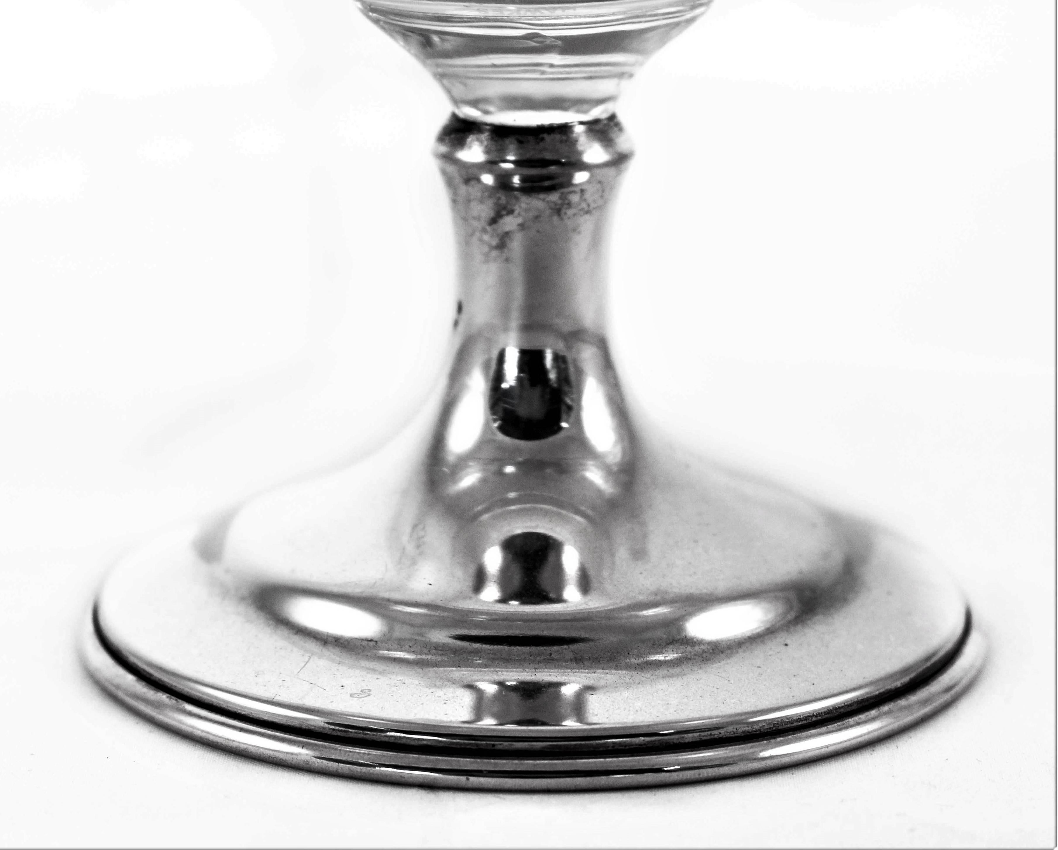 An usually shaped crystal and sterling compote by the finest American crystal maker, Hawkes Crystal Co. Acid-etched crystal in an oval shape with a scalloped rim. Too pretty to keep stored away, this is the perfect piece to have out at all times on