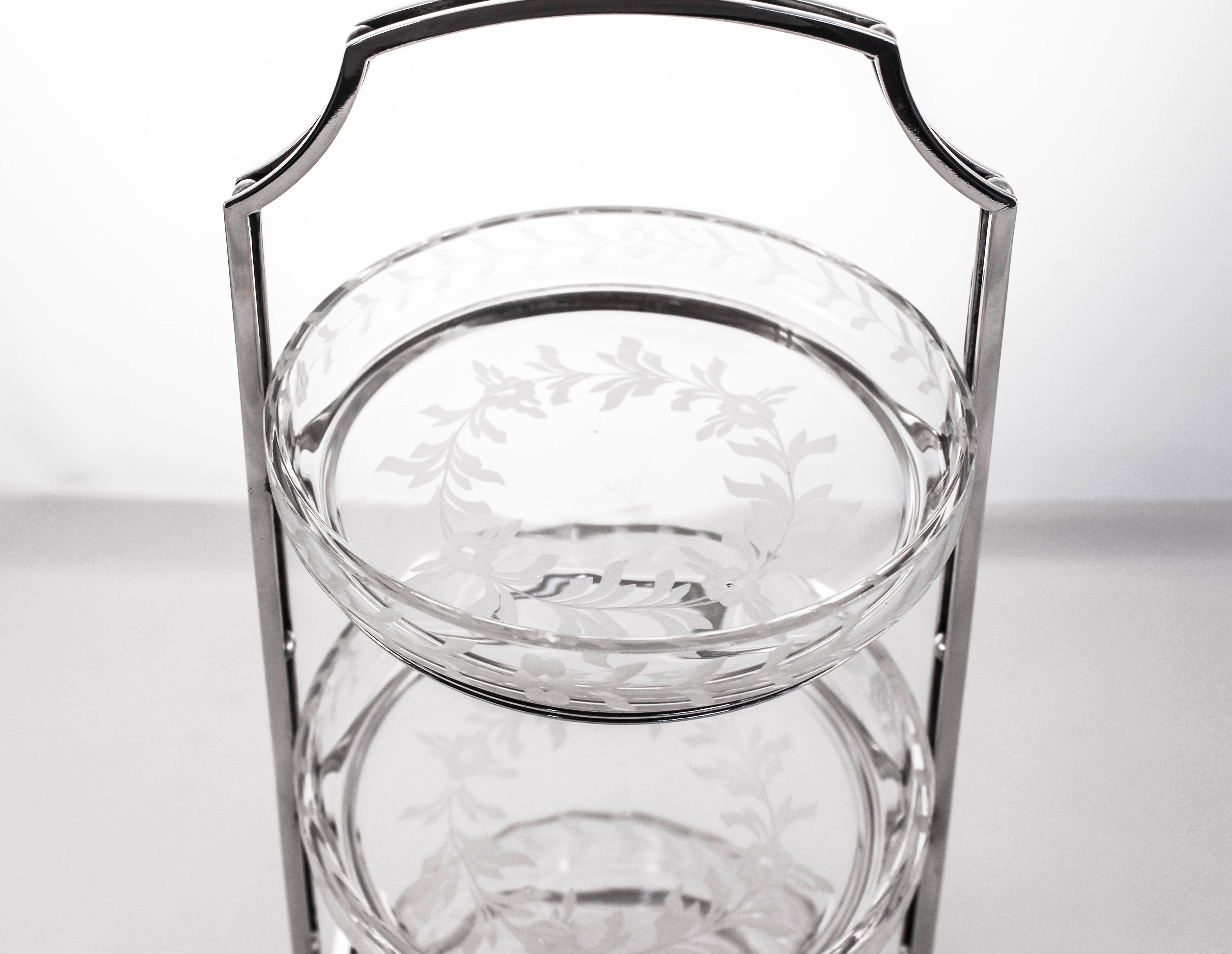 This sterling silver piece is just amazing; we have never had anything like this before. Made by the world famous Hawkes Glass Co in the 1920s. Three crystal dishes sit in a sterling silver carrier that is in the Art Deco style. The crystal has an