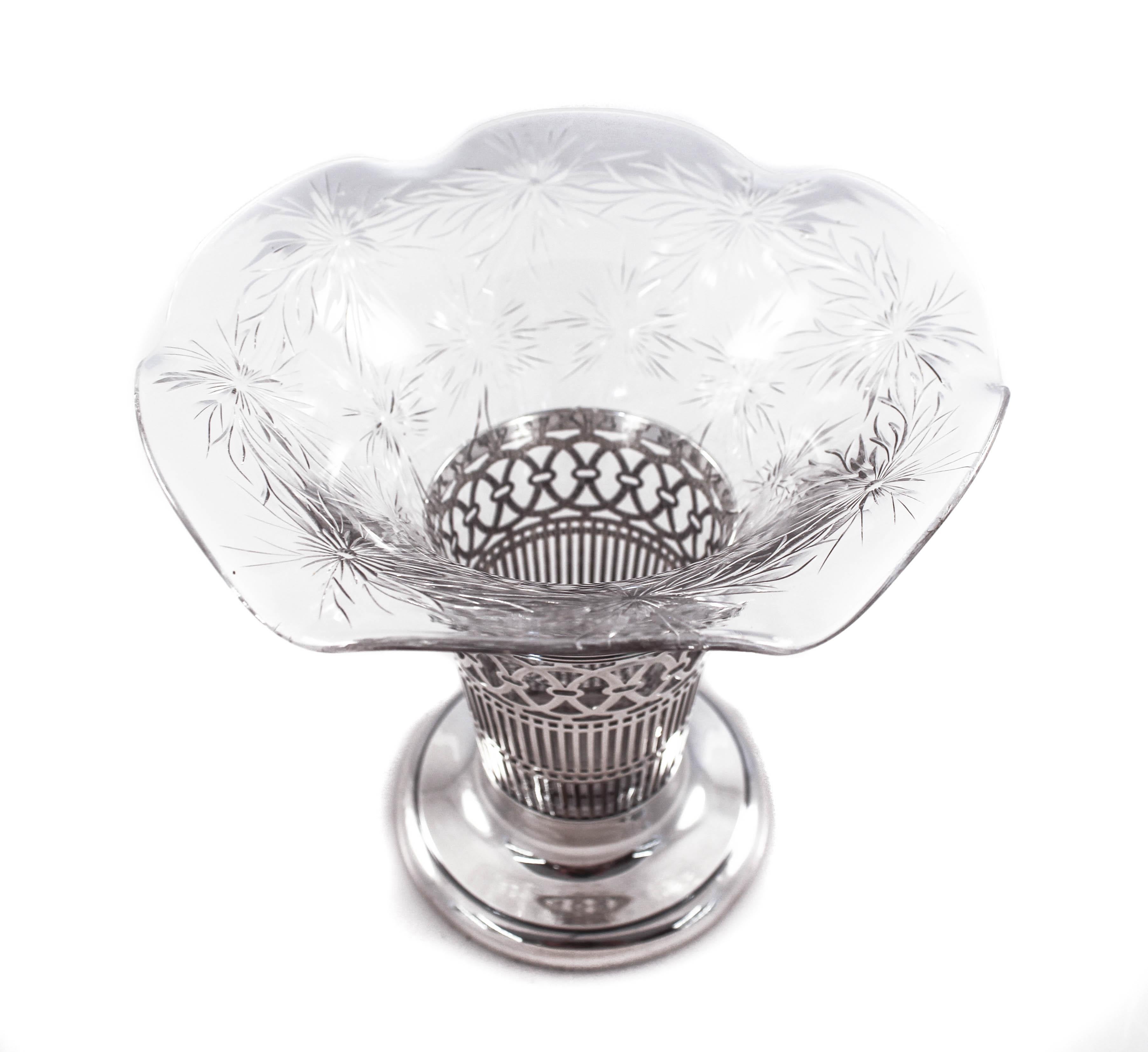 We are happy to offer this sterling and crystal vase by the Hawkes Glass Company. Based in Corning, NY, T.G. Hawkes & Co. (circa 1880-1959) was established by Thomas Gibbons Hawkes (1846-1913). Born in Ireland, Hawkes immigrated to Brooklyn in 1862,