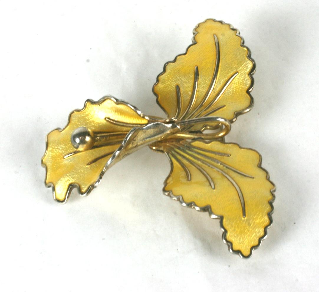 Sterling and Enamel Norwegian Orchid Brooch from the 1950's. Yellow enamel on a 3 dimesional orchid set in vermeil sterling. 
2.5