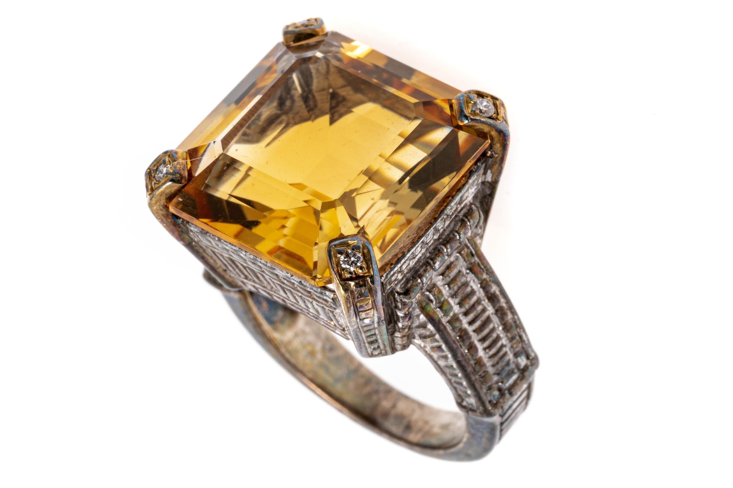 Sterling silver and gold ring. This interesting patterned sterling silver ring features a square faceted, medium to light golden yellow color center citrine, approximately 13.74 CTS, decorated with round faceted, diamond set prongs, approximately