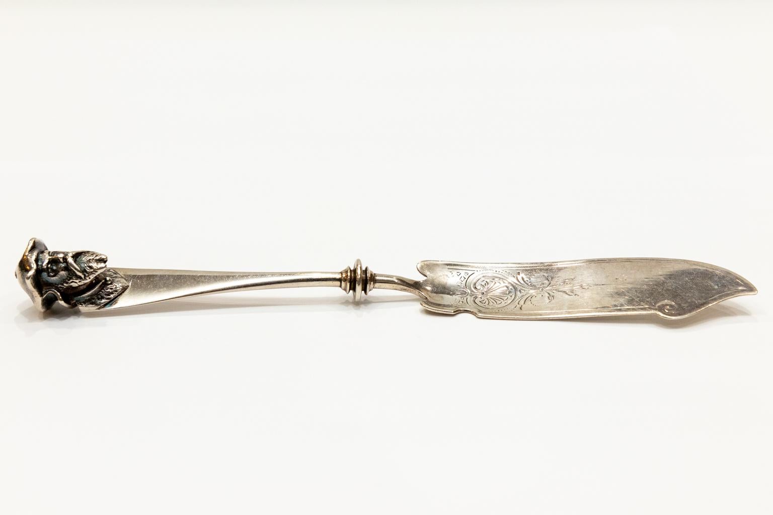 Sterling silver 3-dimensional head antique butter knife. Please note of wear consistent with age.