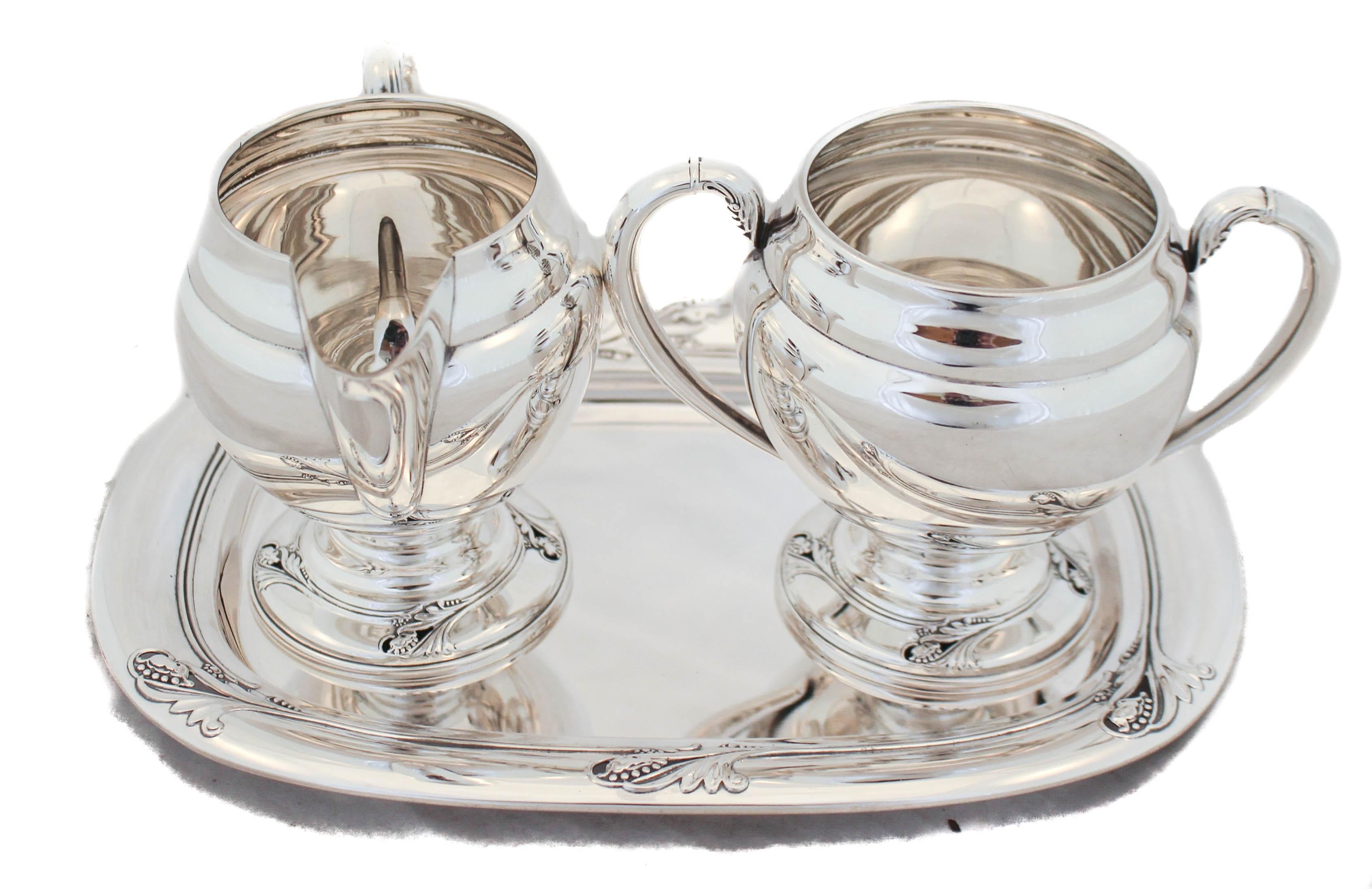 Being offered is a sterling silver creamer, sugar bowl and tray in the Spring Glory pattern by International Silver, 1942. This gorgeous Art Deco pattern has been a favorite ever since it was introduced in 1942. Each of the three pieces is signed
