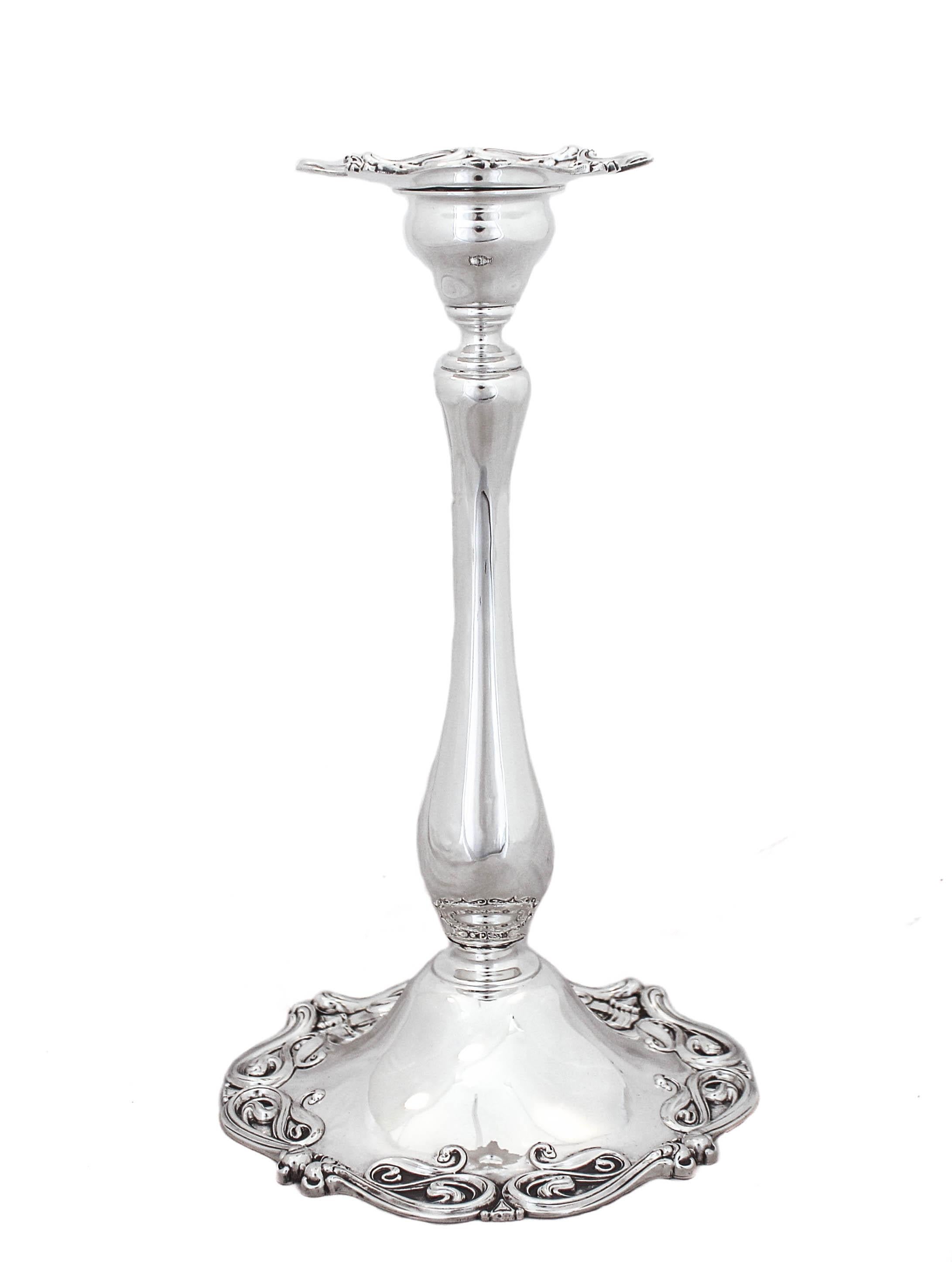 These gorgeous sterling silver Art Nouveau candlesticks by Frank Whiting are yours for the taking.
Art Nouveau is characterized by its use of long, sinuous, organic line and was employed most often in interior design, jewelry and silver. Notice the