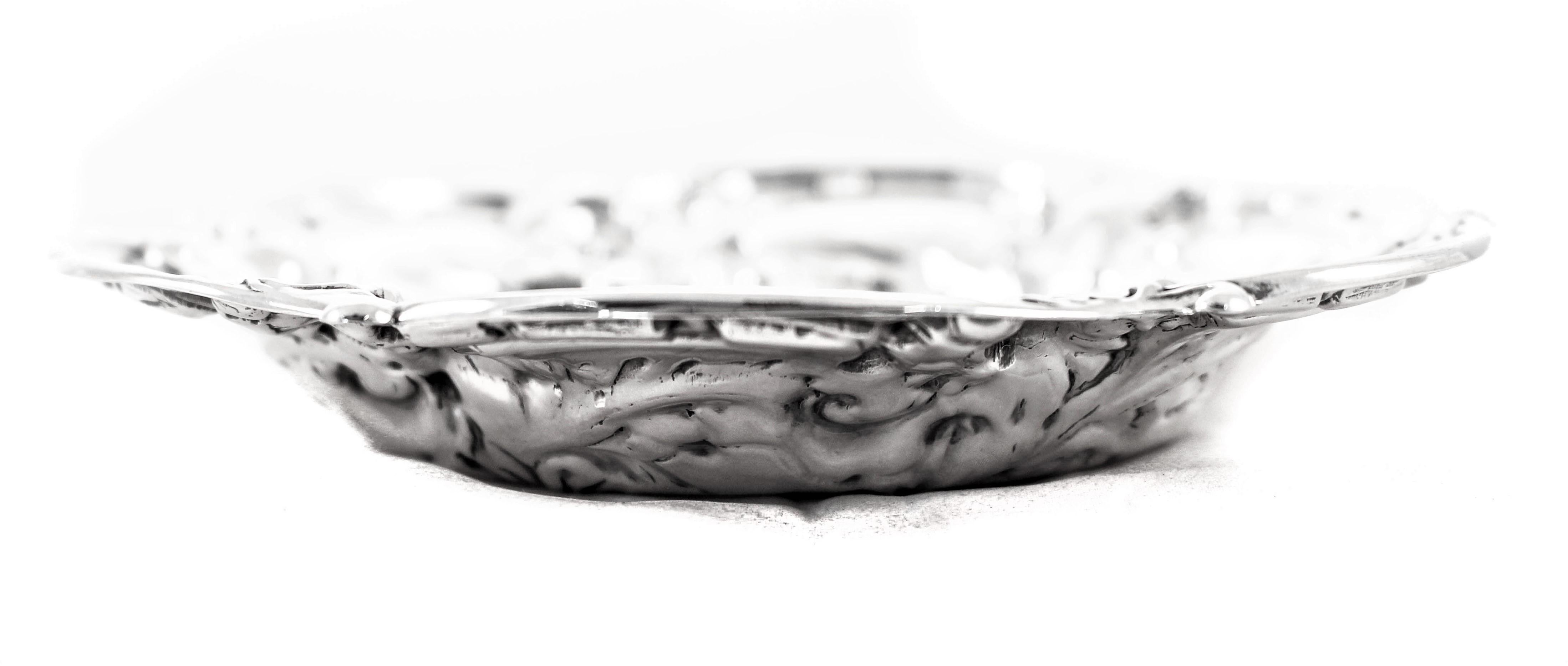 A fabulous piece of estate sterling silver from 1948. It has a scalloped edge with blown-out flowers and is in the Art Nouveau style. Inspired by natural forms particularly the curved lines of plants and flowers, the Art Nouveau movement looked to
