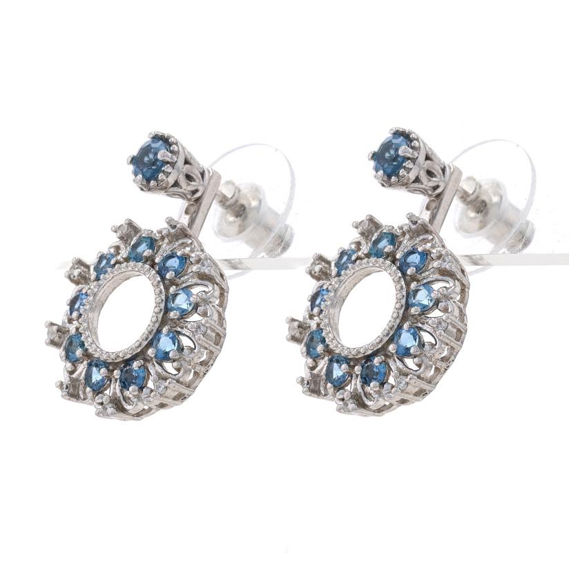 Metal Content: Sterling Silver

Stone Information
Natural Blue Topaz
Treatments: Routinely Enhanced & Coated

Natural White Topaz

Style: Studs with Removable Front-Back Dangle Jacket Enhancers
Fastening Type: Butterfly Closures
Features: Milgrain