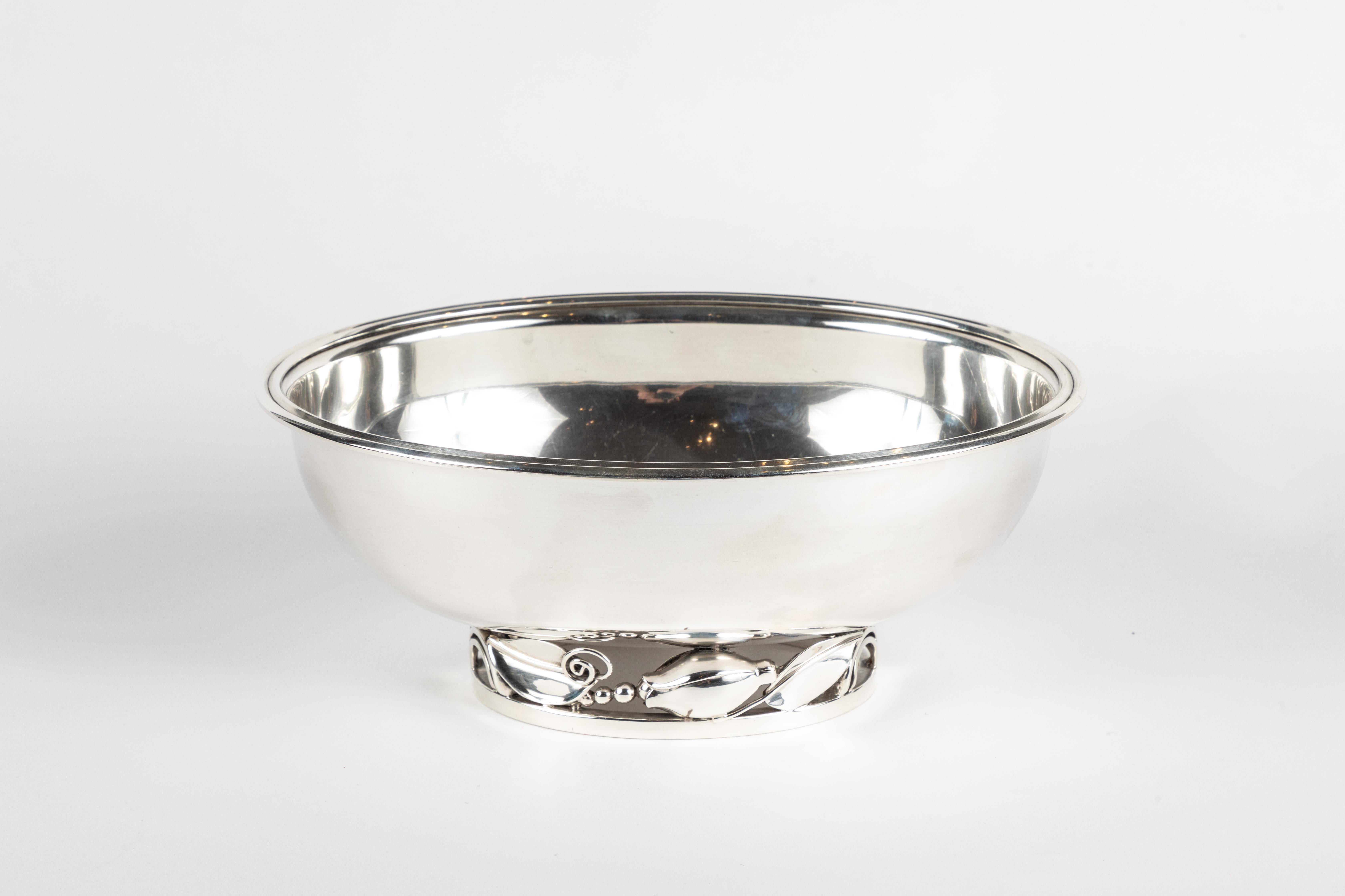 Very heavy sterling silver footed oval bowl designed by Alphonse LaPaglia for International Silver. This substantial bowl rests on an articulated foot comprised of scrolling blossoms and beads. Signed on the underside INTERNATIONAL STERLING LA