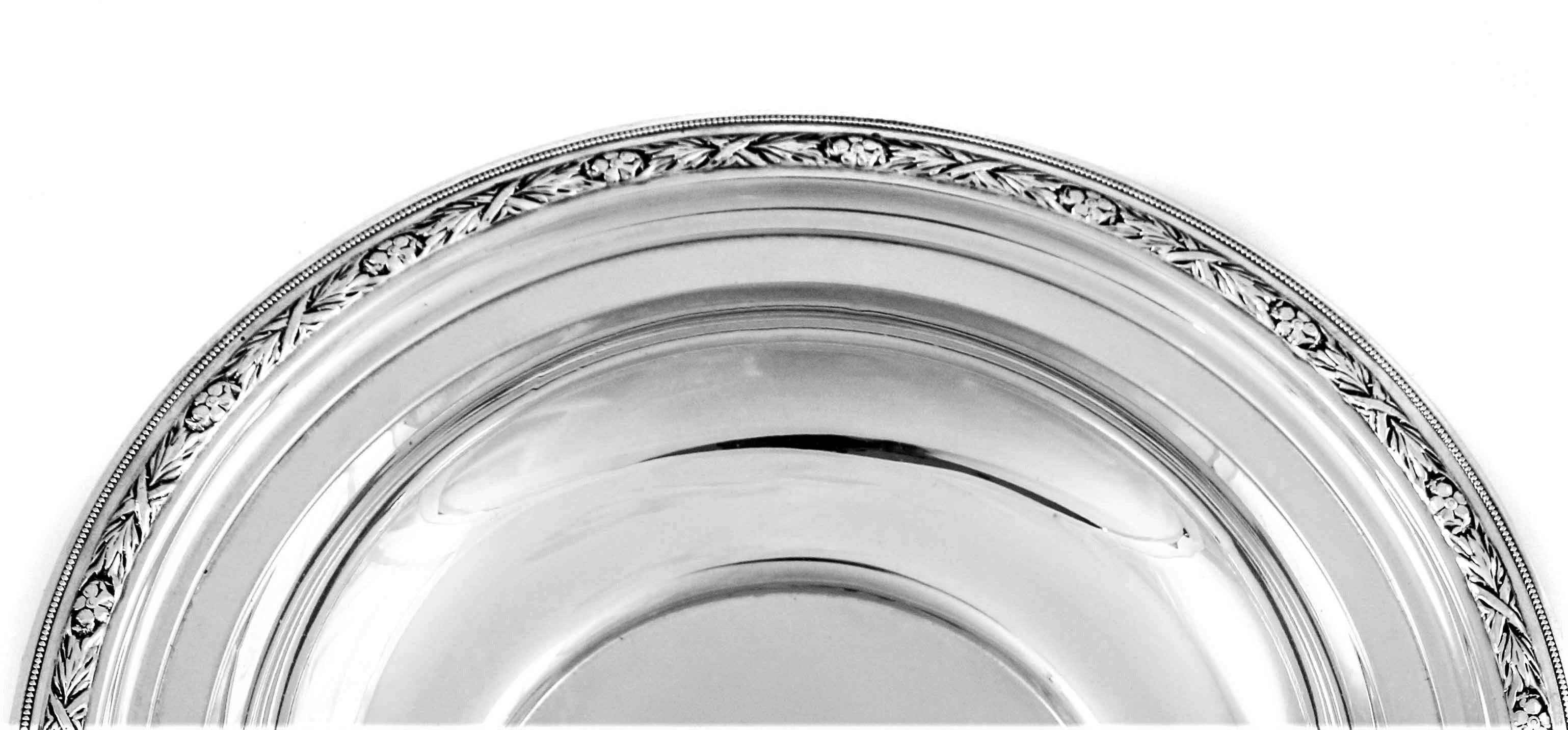 This sterling bowl is great for appetizers, side-dishes or even fruit, it’s a nice practical size. A simple decorative pattern of wreaths intersected by flowers runs the entire border.