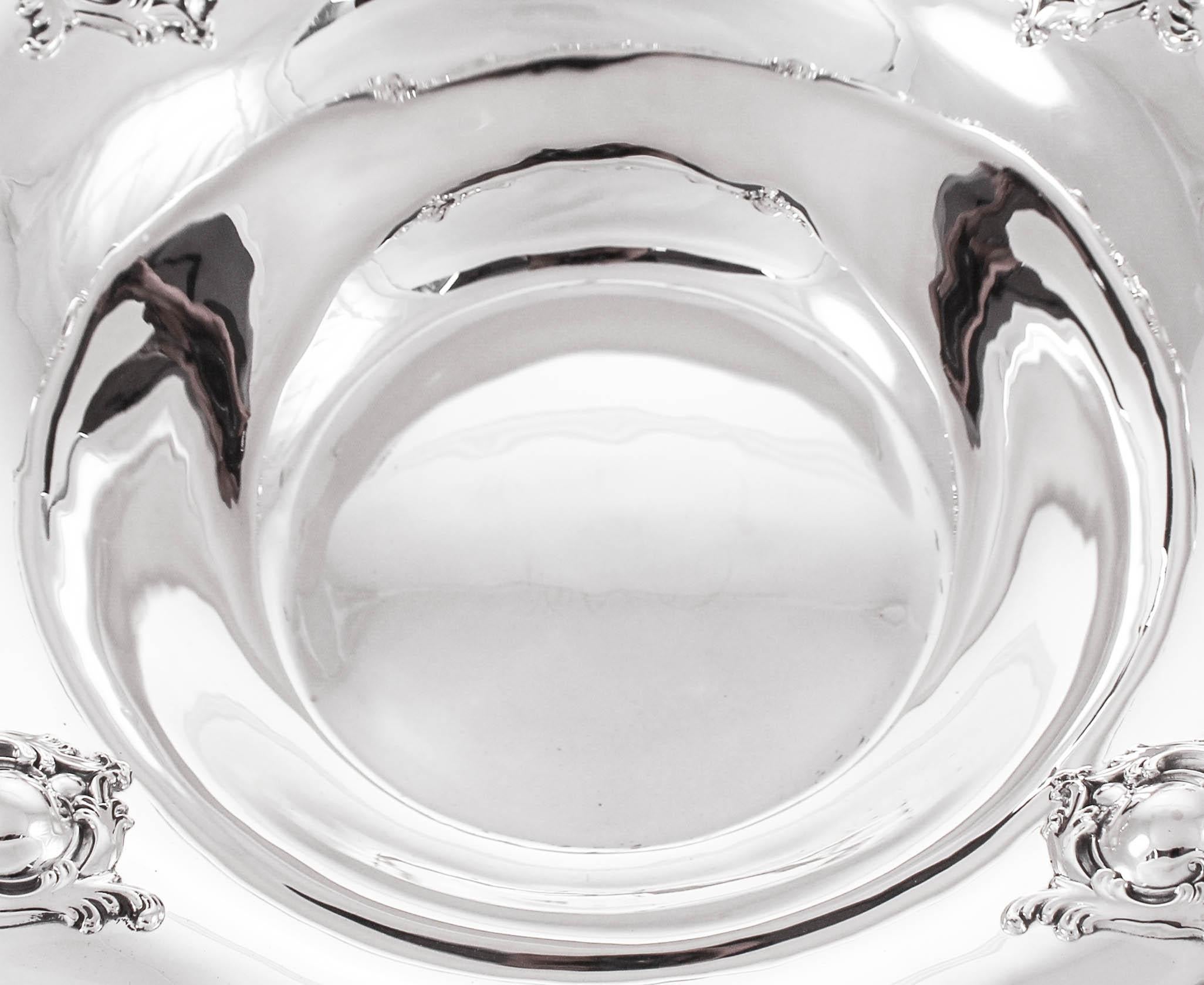 This sterling silver bowl has a scalloped edge with raised-work along the rim. Four medallion-like designs surrounded by the same type of raised-work. It’s an impressive looking piece and very functional.